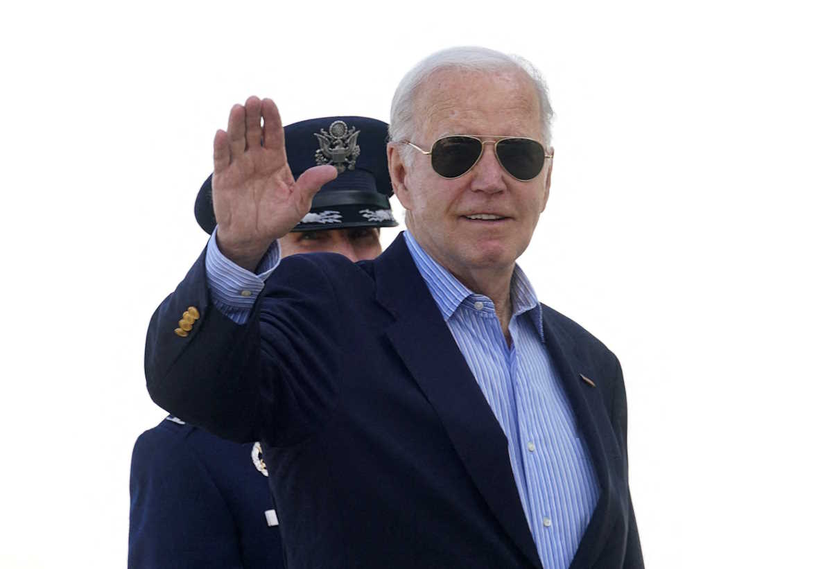 FILE PHOTO: U.S. President Joe Biden waves as he boards Air Force One upon his departure for the G7 summit in Italy, from Joint Base Andrews in Maryland, U.S., June 12, 2024.  REUTERS