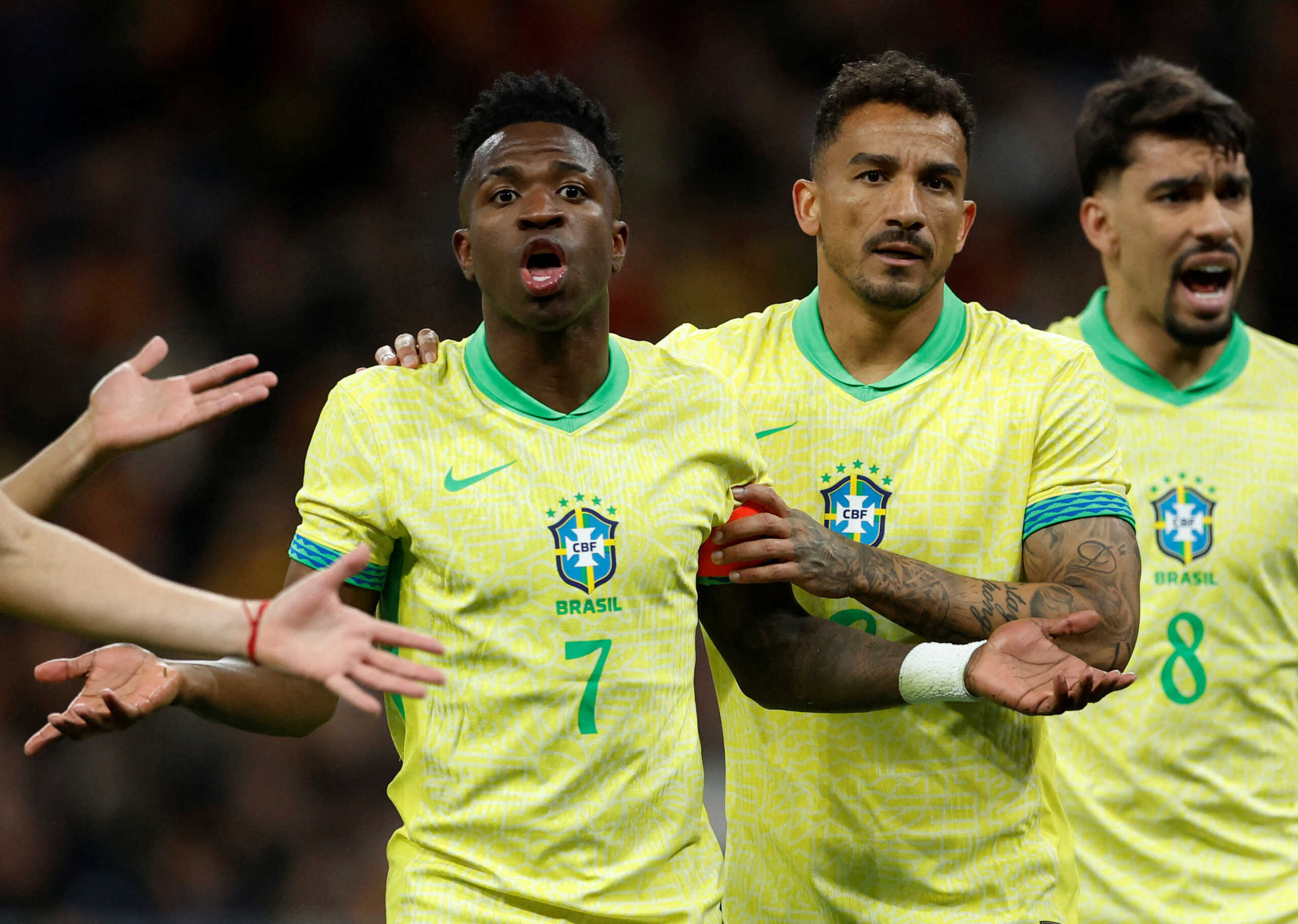 FILE PHOTO: Soccer Football - International Friendly - Spain v Brazil - Santiago Bernabeu, Madrid, Spain - March 26, 2024  Brazil's Danilo and Vinicius Junior react after Spain were awarded a penalty REUTERS