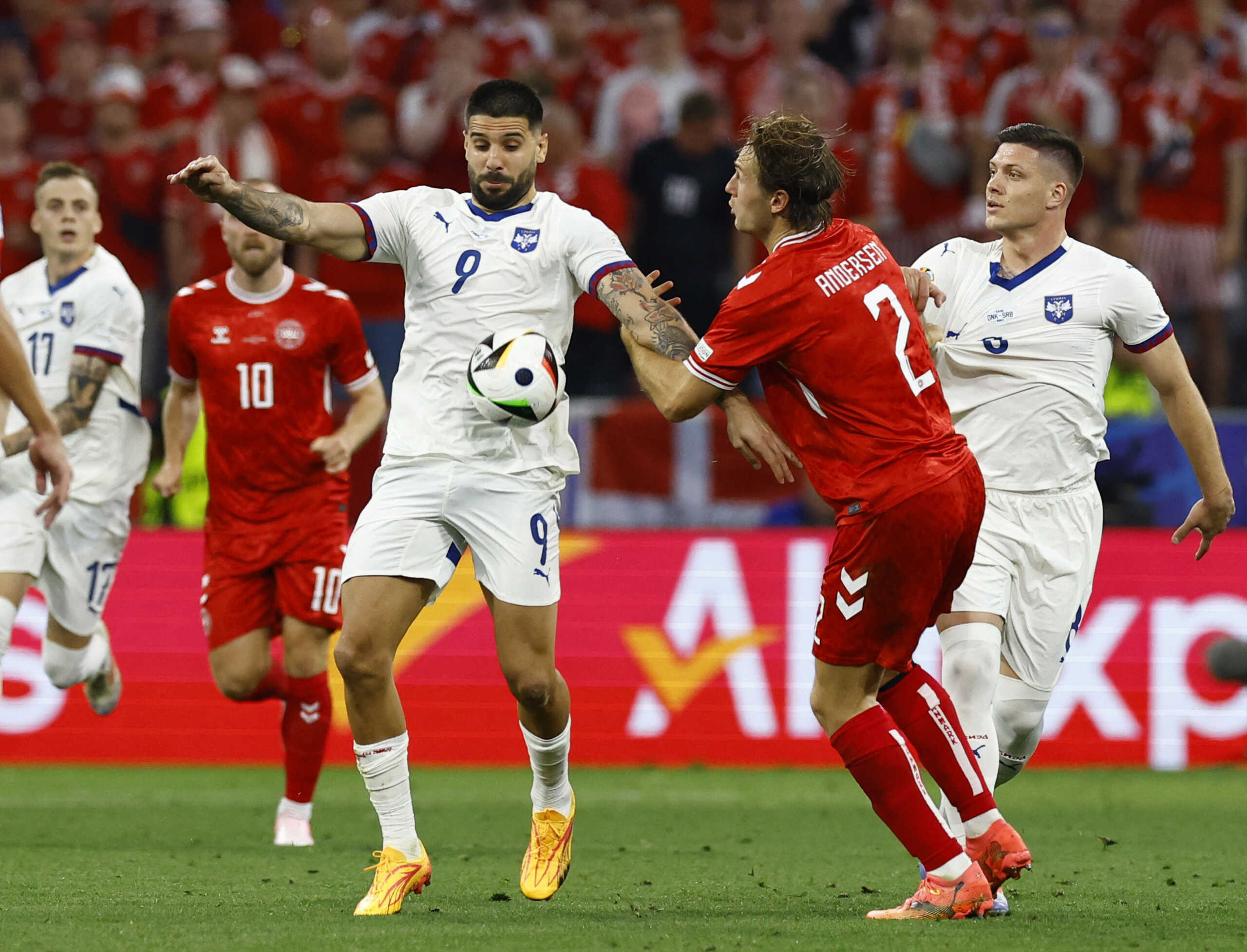 Soccer Football - Euro 2024 - Group D - Denmark v Serbia - Munich Football Arena, Munich, Germany - June 25, 2024 Serbia's Aleksandar Mitrovic in action with Denmark's Joachim Andersen REUTERS