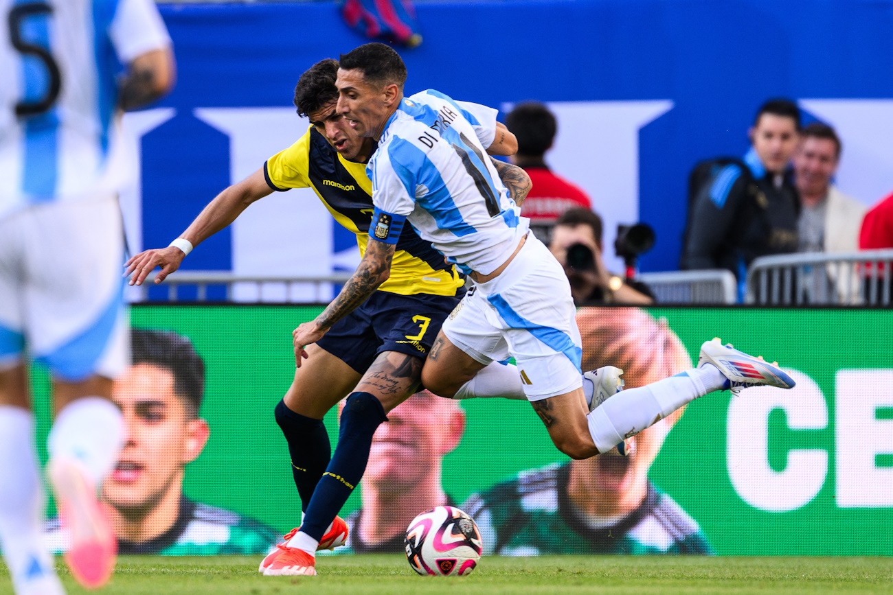 Jun 9, 2024; Chicago, Illinois, USA; Ecuador defender Piero Hincapie (3) and Argentina forward Angel Di Maria (11) battle for the ball during the second half at Soldier Field. Mandatory Credit: Daniel Bartel-USA TODAY Sports