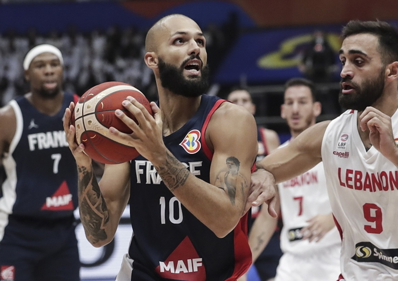 epa10826507 Evan Fournier (L) of France in action against Sergio El Darwich (R) of Lebanon during the FIBA Basketball World Cup 2023 group stage match between Lebanon and France in Jakarta, Indonesia, 29 August 2023.  EPA