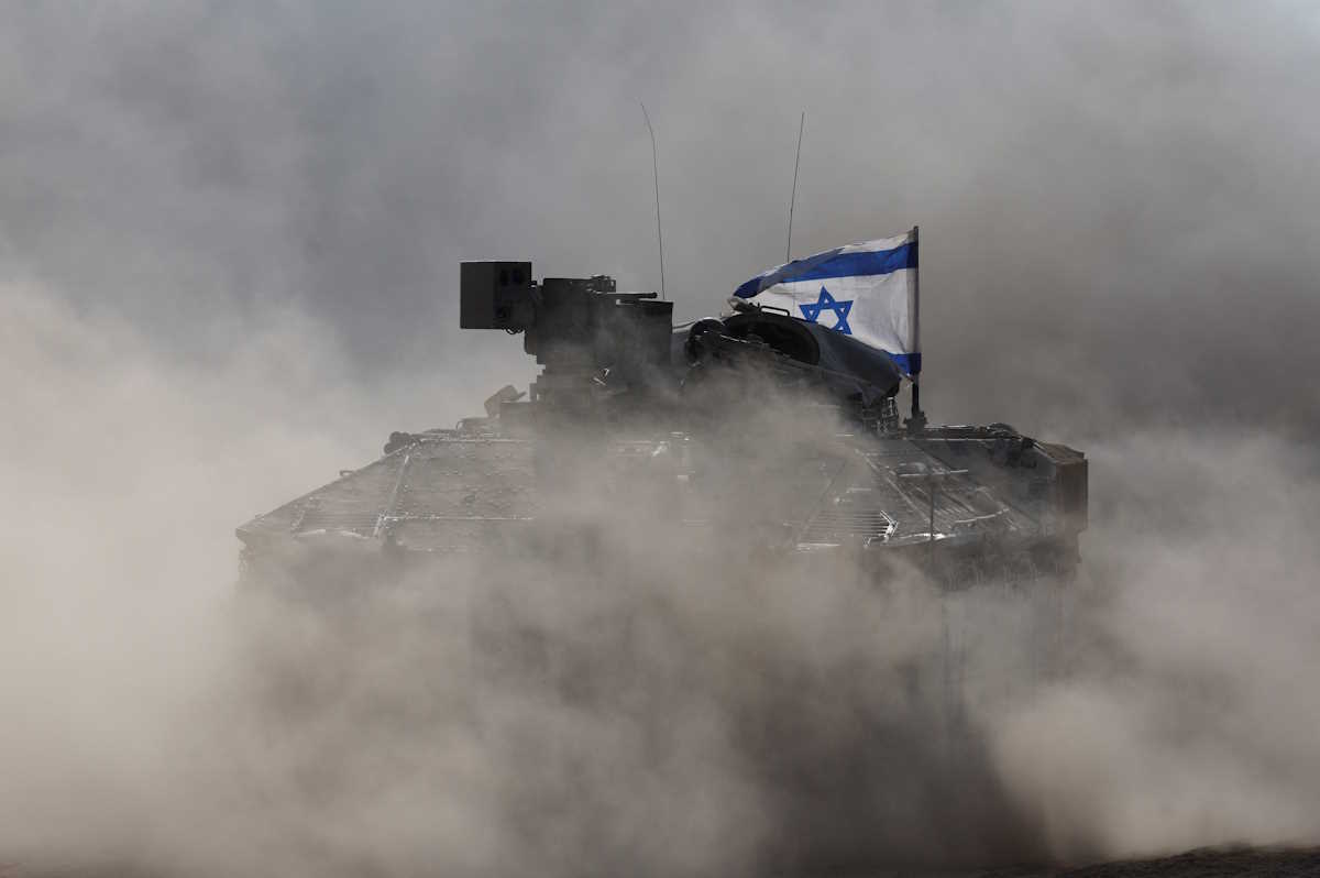 An Israeli armoured personnel carrier (APC) operates, amid the ongoing conflict between Israel and the Palestinian Islamist group Hamas, near Israel's border with Gaza in southern Israel, May 29, 2024. REUTERS