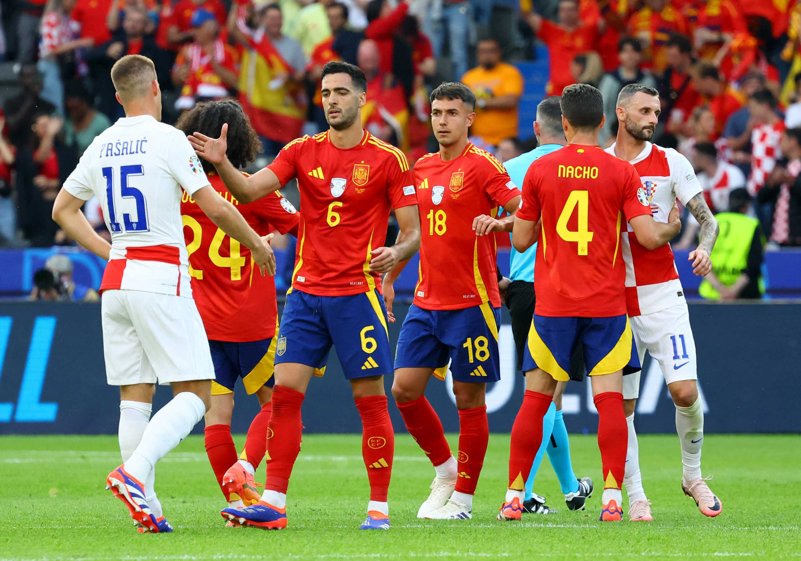 Soccer Football - Euro 2024 - Group B - Spain v Croatia - Berlin Olympiastadion, Berlin, Germany - June 15, 2024  Spain's Mikel Merino, Martin Zubimendi and Nacho with Croatia's Mario Pasalic and Marcelo Brozovic after the match REUTERS