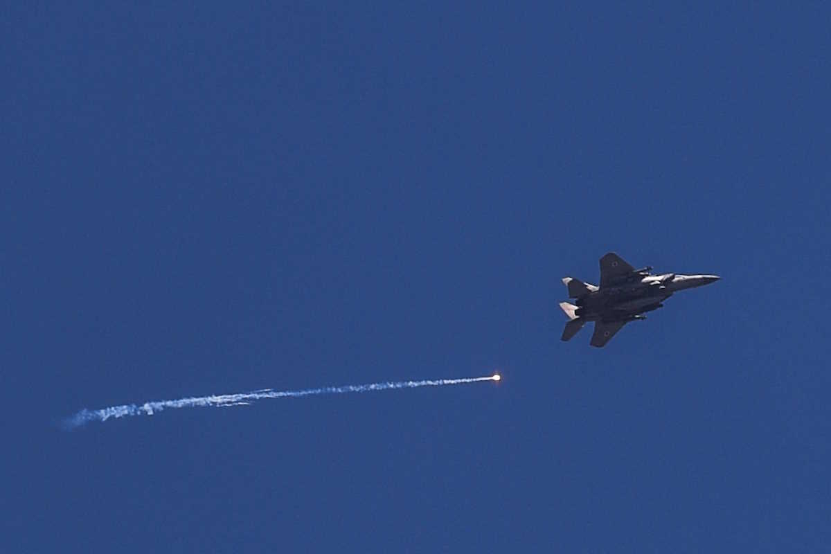An Israeli war jet flies over the Israel Lebanon border amid ongoing cross-border hostilities between Hezbollah and Israeli forces, in northern Israel June 13, 2024. REUTERS
