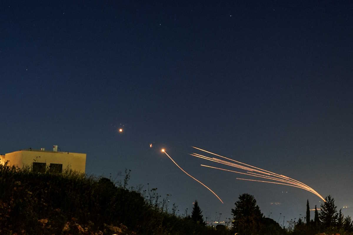 FILE PHOTO: Israel's Iron Dome anti-missile system intercepts rockets launched from Lebanon towards Israel over the Israeli Lebanese border, as seen from northern Israel, April 12, 2024. REUTERS