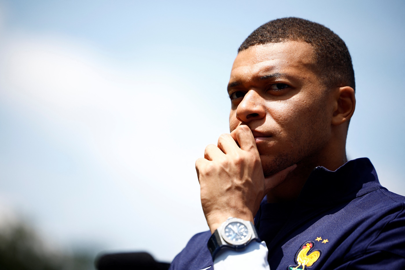 French soccer player Kylian Mbappe listens to French President Emmanuel Macron as he arrives for a lunch at their training camp ahead of the UEFA Euro 2024, in Clairefontaine-en-Yvelines, France, June 3, 2024. REUTERS