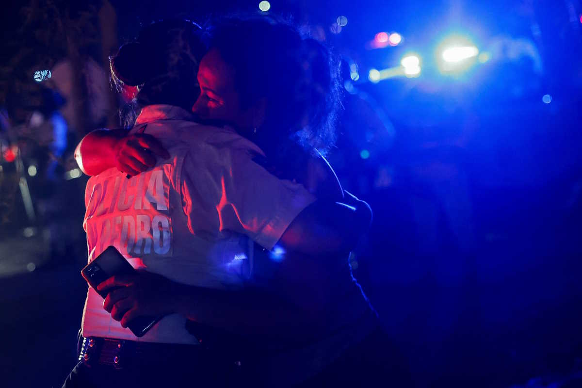 A woman looking for her missing relative embraces a police officer at the site after a gust of wind caused a structure to collapse, resulting in multiple fatalities and injuries, at a campaign event for the Citizens' Movement party, in San Pedro Garza Garcia, Nuevo Leon, Mexico May 22, 2024. REUTERS