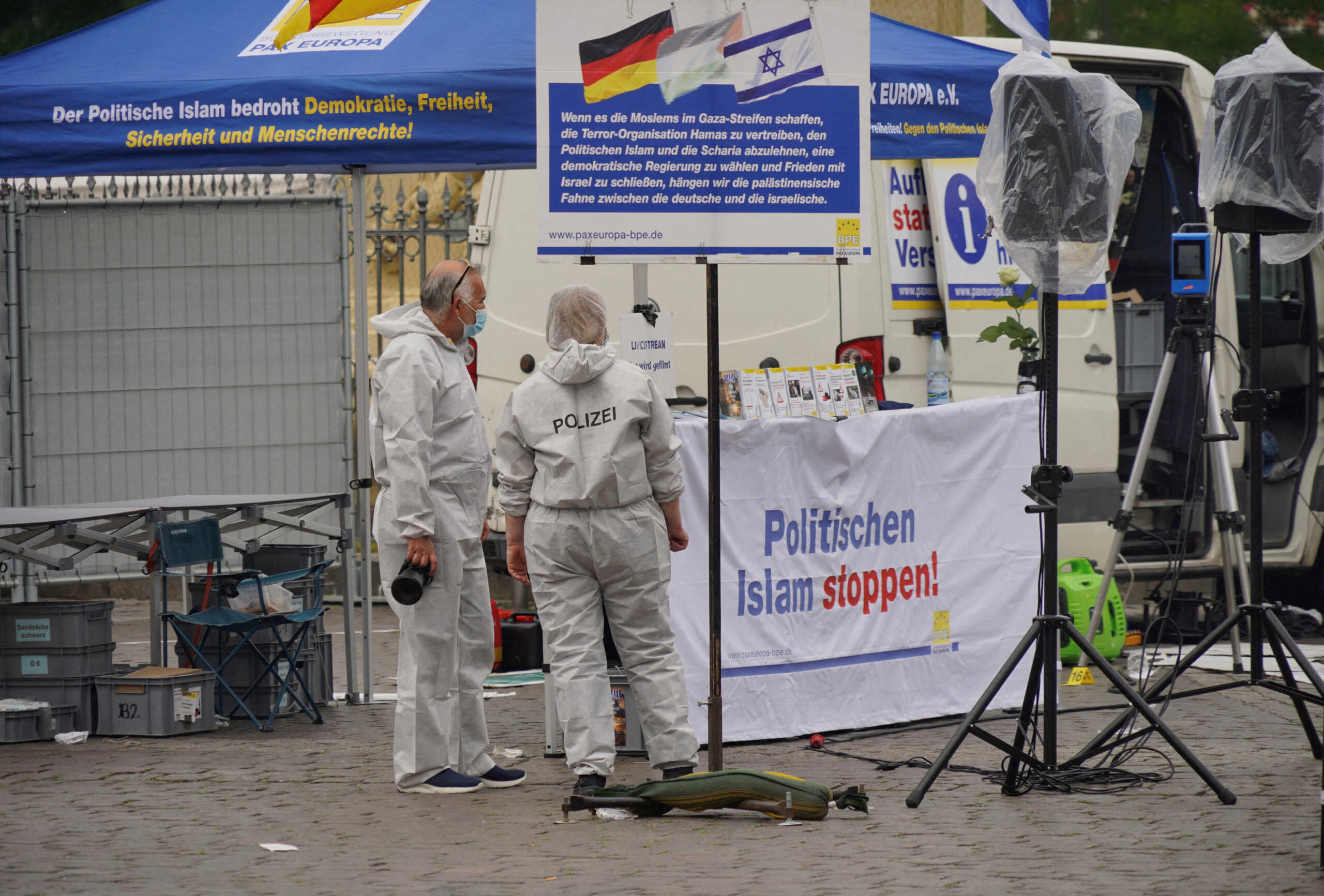Police investigators work at the scene where a man attacked people at a far right-wing information stand of the Buergerbewegung Pax Europa (BPE) in the central market of the city of Mannheim, Germany, May 31, 2024. REUTERS