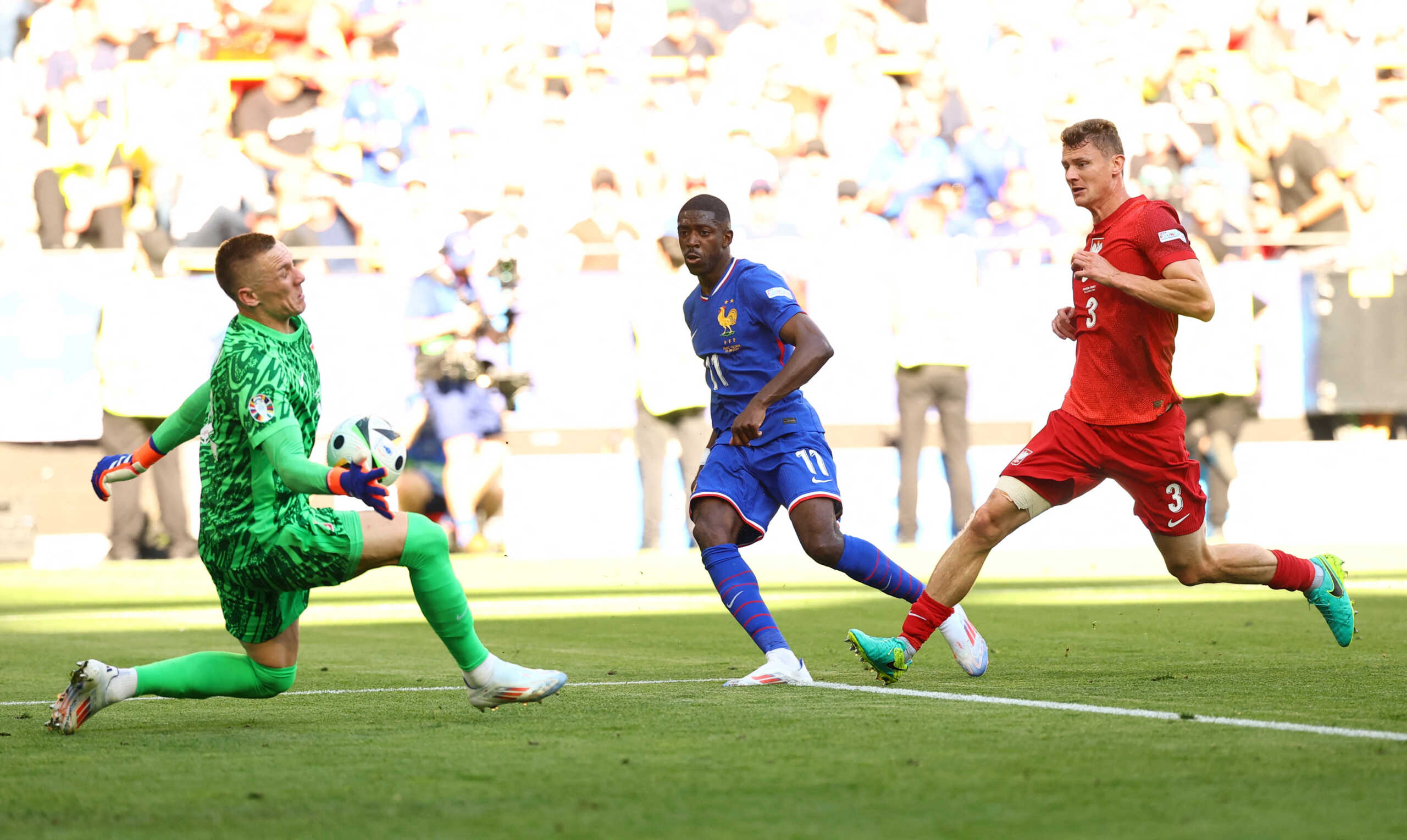 Soccer Football - Euro 2024 - Group D - France v Poland - Dortmund BVB Stadion, Dortmund, Germany - June 25, 2024 France's Ousmane Dembele has his shot saved by Poland's Lukasz Skorupski REUTERS