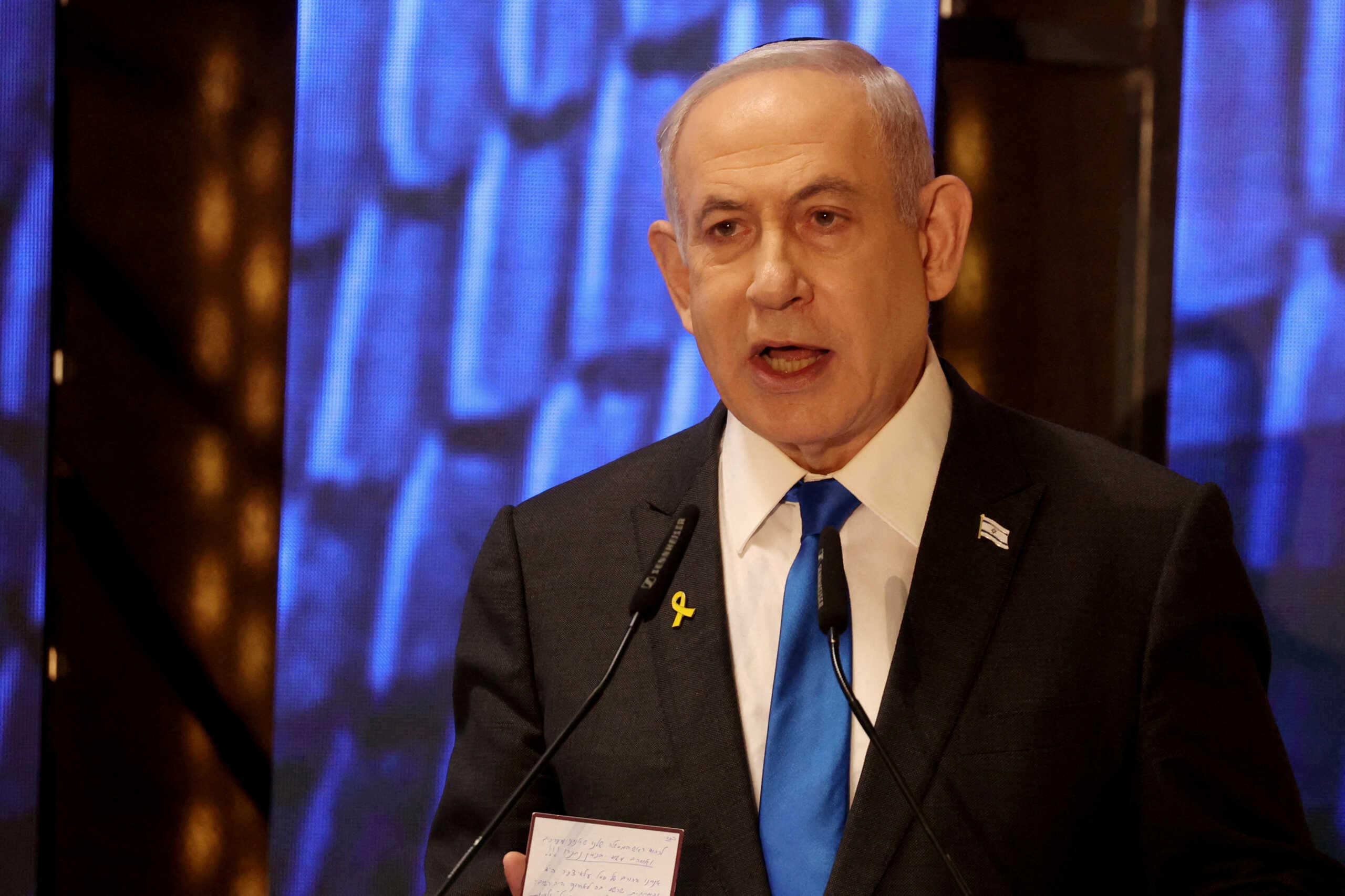 FILE PHOTO: Israeli Prime Minister Benjamin Netanyahu speaks during a ceremony marking Memorial Day for fallen soldiers of Israel's wars and victims of attacks, at Jerusalem's Mount Herzl military cemetery, May 13, 2024. GIL COHEN-MAGEN