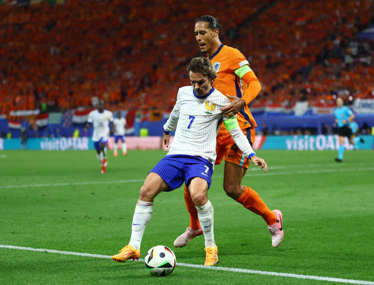 Soccer Football - Euro 2024 - Group D - Netherlands v France - Leipzig Stadium, Leipzig, Germany - June 21, 2024  Netherlands' Virgil van Dijk in action with France's Antoine Griezmann REUTERS