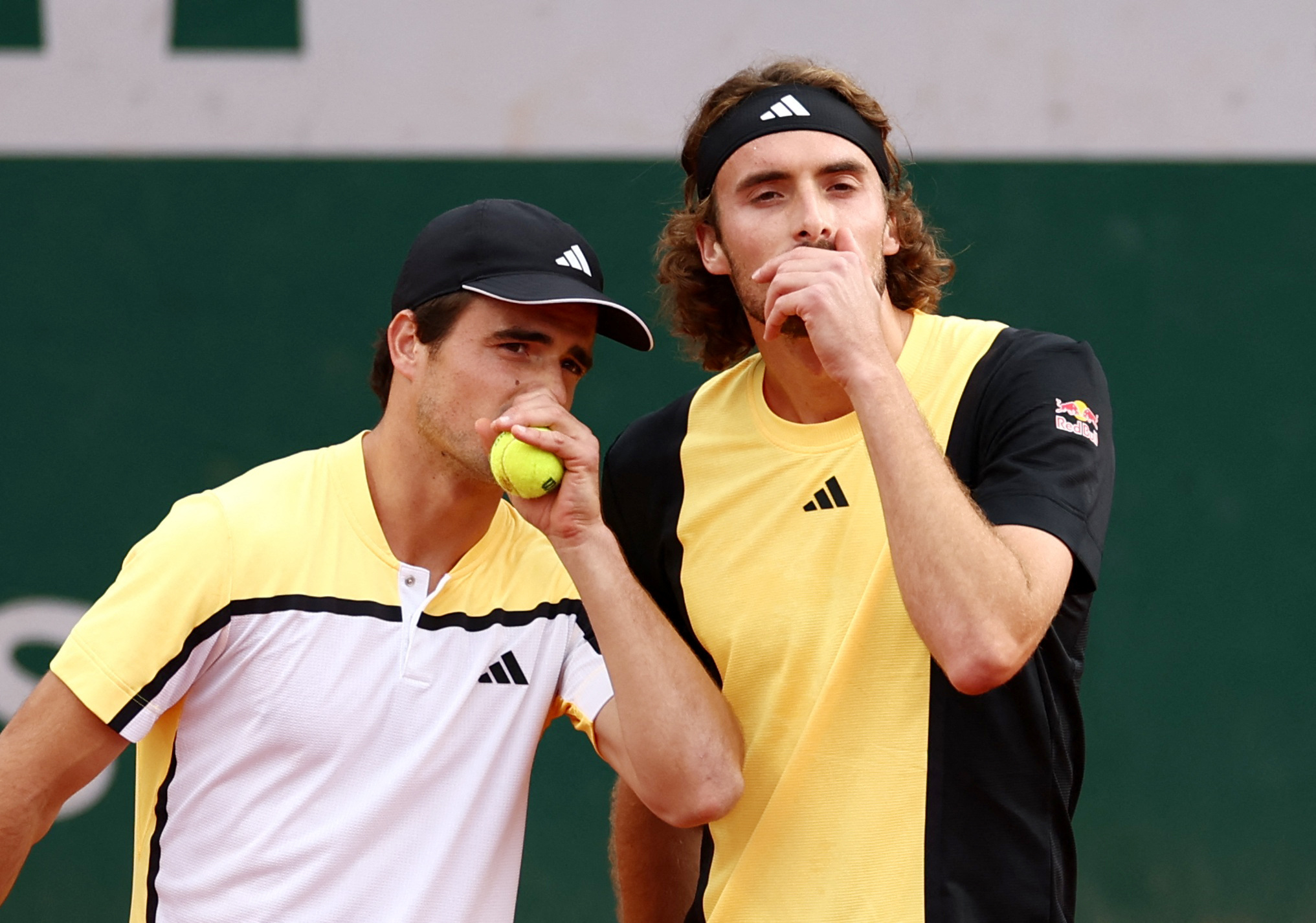Tennis - French Open - Roland Garros, Paris, France - June 2, 2024 Greece's Petros and Stefanos Tsitsipas talk during their men's doubles first round match against Ukraine's Denys Molchanov and Australia's John Patrick Smith REUTERS