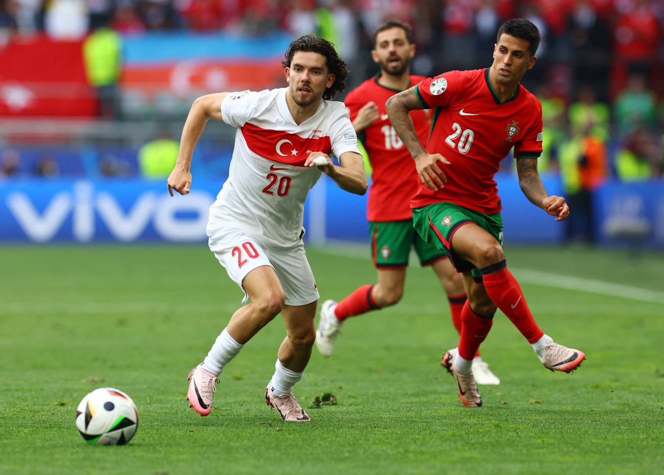 Soccer Football - Euro 2024 - Group F - Turkey v Portugal - Dortmund BVB Stadion, Dortmund, Germany - June 22, 2024 Turkey's Ferdi Kadioglu in action with Portugal's Joao Cancelo REUTERS