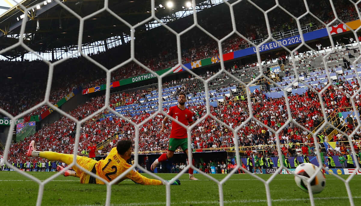 Soccer Football - Euro 2024 - Group F - Turkey v Portugal - Dortmund BVB Stadion, Dortmund, Germany - June 22, 2024 Portugal's Bruno Fernandes scores their third goal past Turkey's Altay Bayindir REUTERS