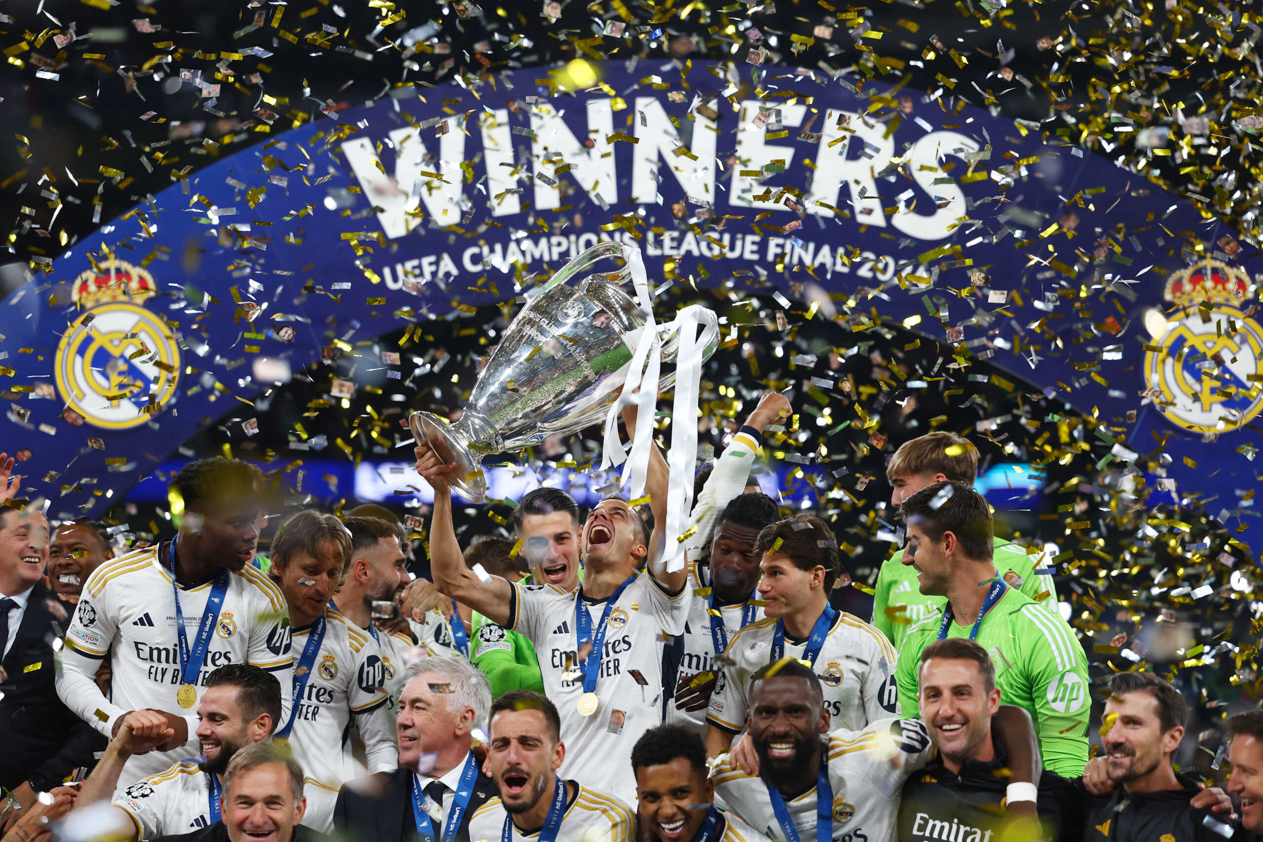 Soccer Football - Champions League - Final - Borussia Dortmund v Real Madrid - Wembley Stadium, London, Britain - June 1, 2024 Real Madrid's Lucas Vazquez lifts the trophy as he celebrates with teammates after winning the Champions League REUTERS