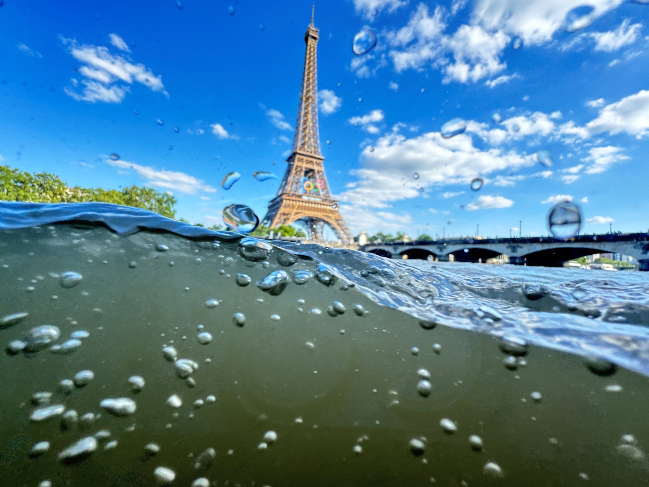 Paris 2024 Olympics - Paris, France - June 23, 2024 The Eiffel Tower is seen from the water of the Seine River as the Olympics opening ceremony rehearsal is postponed amid rainy weather. REUTERS