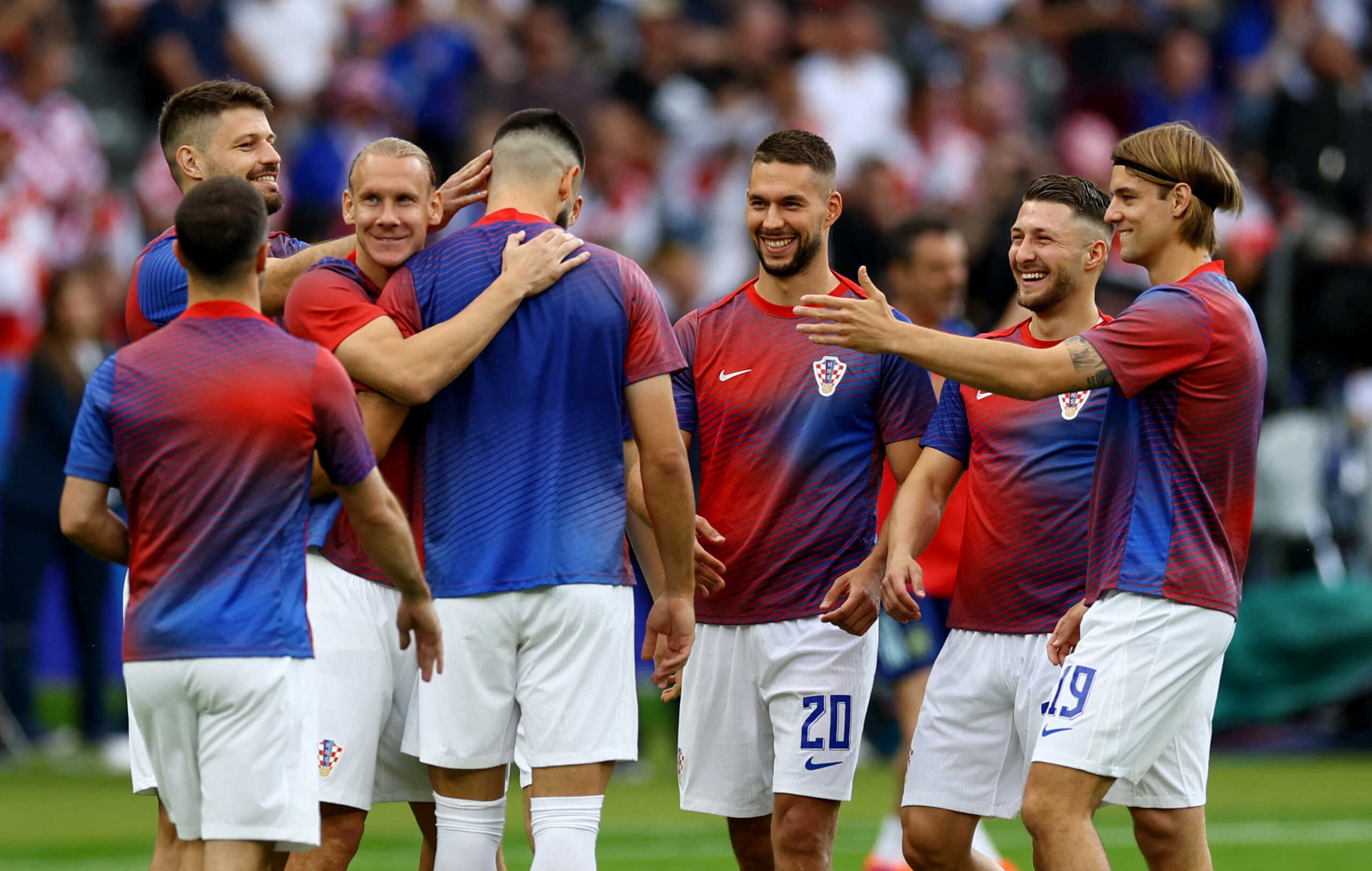 Soccer Football - Euro 2024 - Group B - Spain v Croatia - Berlin Olympiastadion, Berlin, Germany - June 15, 2024 Croatia's Domagoj Vida, Marko Pjaca and teammates during the warm up before the match REUTERS
