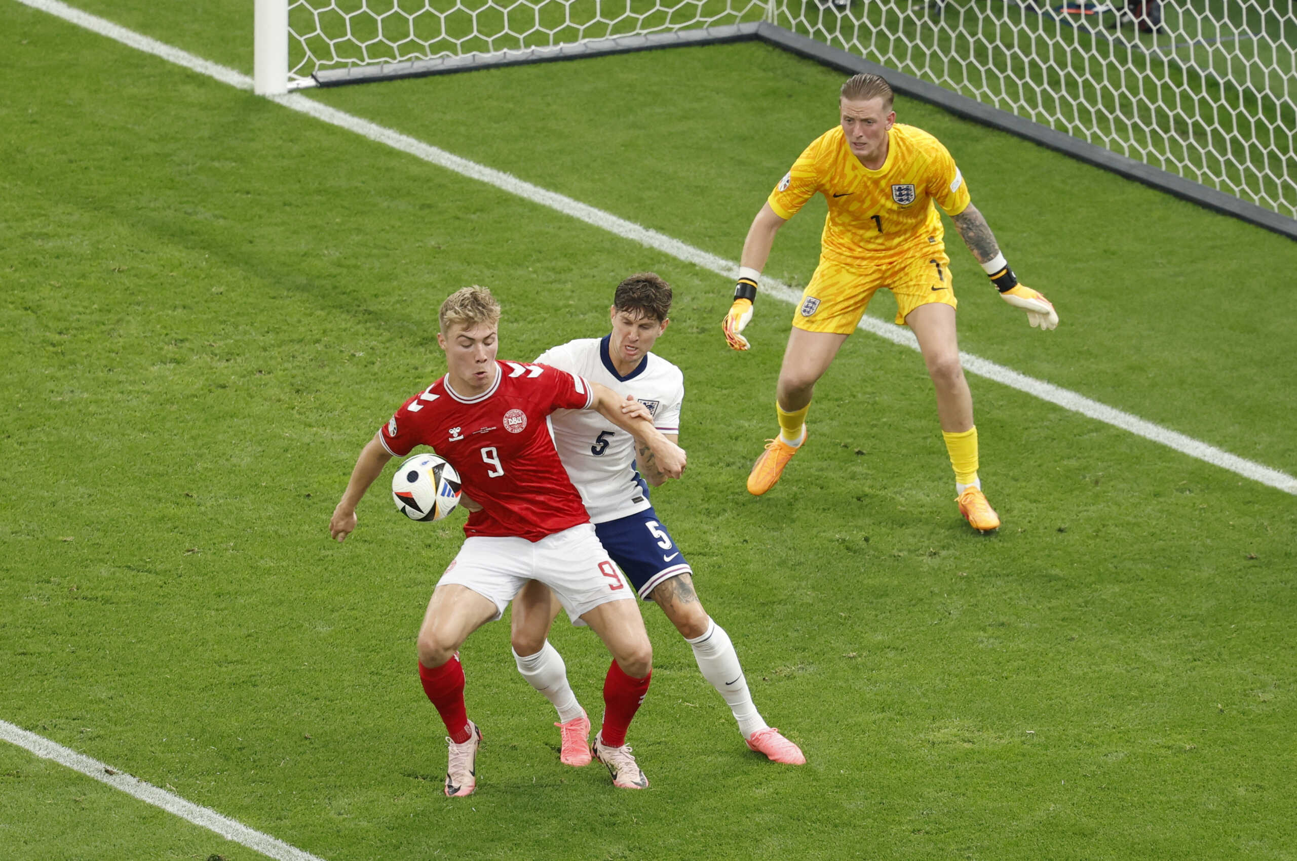 Soccer Football - Euro 2024 - Group C - Denmark v England - Frankfurt Arena, Frankfurt, Germany - June 20, 2024 Denmark's Rasmus Hojlund in action with England's John Stones REUTERS