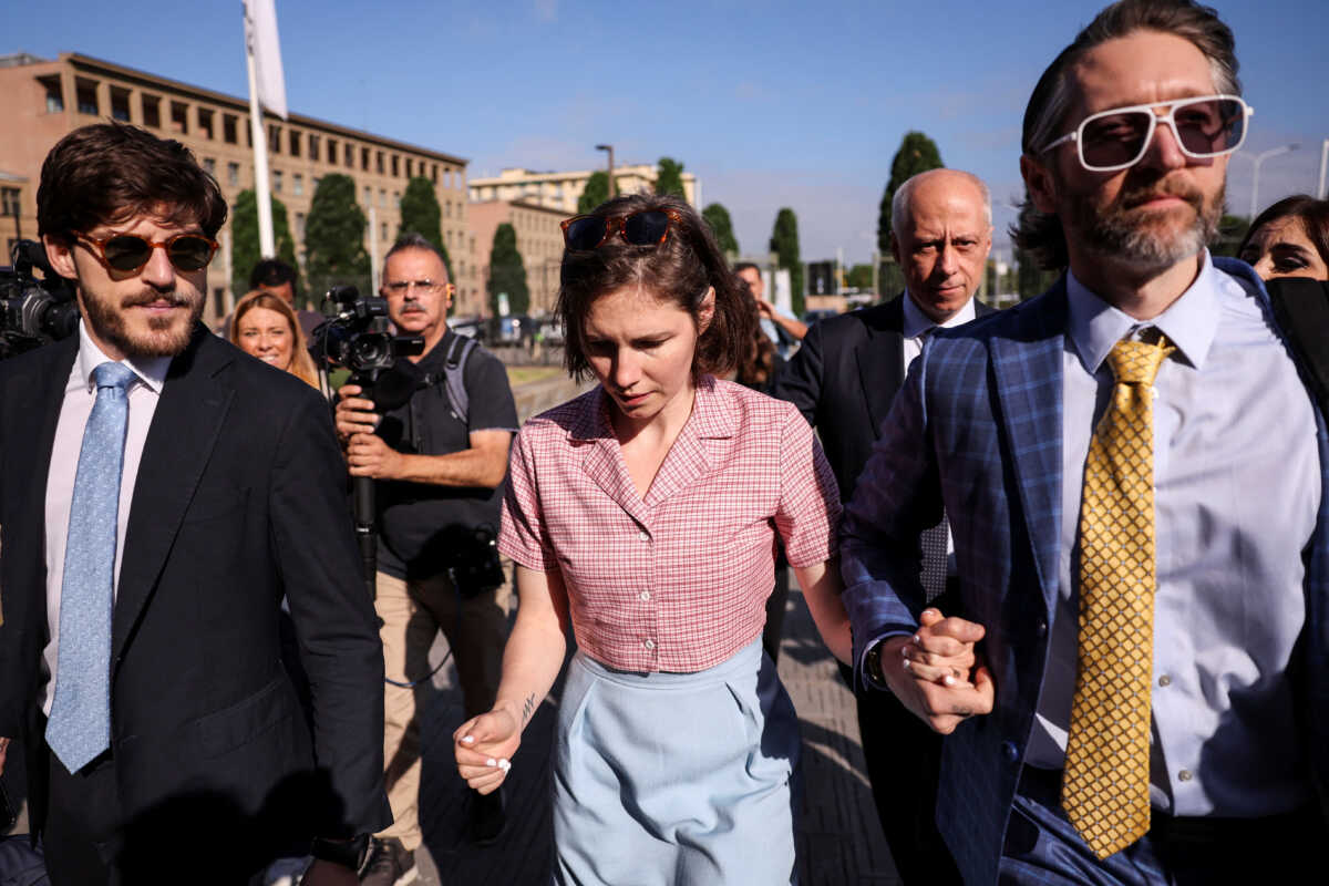 Amanda Knox walks on the day of the verdict in the slander case at Italy Court in Florence, Italy June 5, 2024. REUTERS