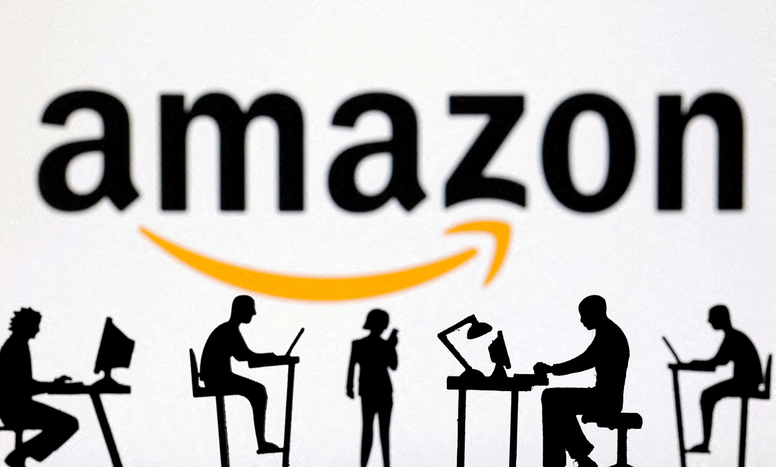 FILE PHOTO: Figurines with computers and smartphones are seen in front of an Amazon logo in this illustration taken Feb. 19, 2024. REUTERS