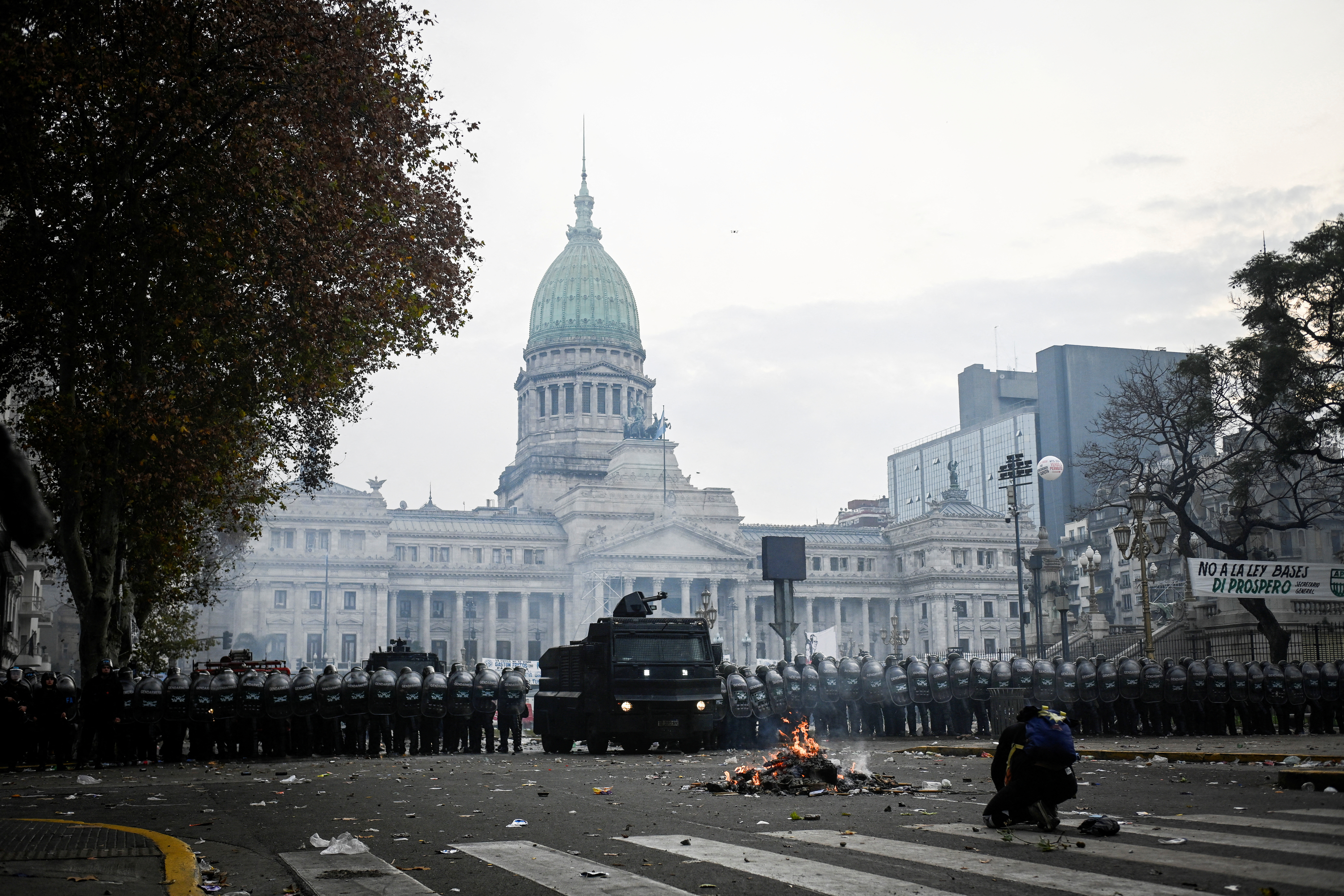 FILE PHOTO: Law enforcement officers stand guard outside the National Congress, on the day senators debate Argentina's President Javier Milei's economic reform bill, known as the "omnibus bill", in Buenos Aires, Argentina, June 12, 2024. REUTERS