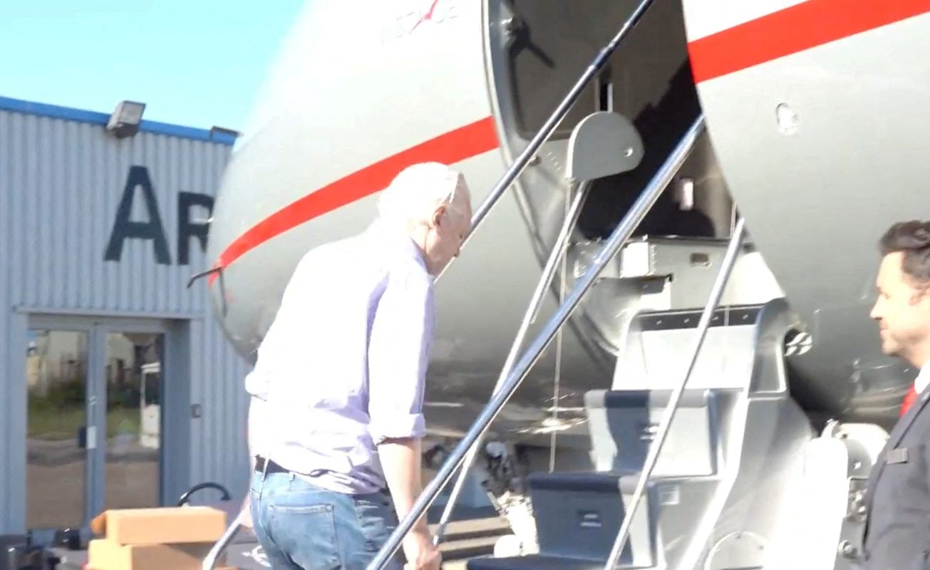 WikiLeaks founder Julian Assange boards a plane at a location given as London, Britain, in this still image from video released JUNE 25, 2024.  "@wikileaks" via X