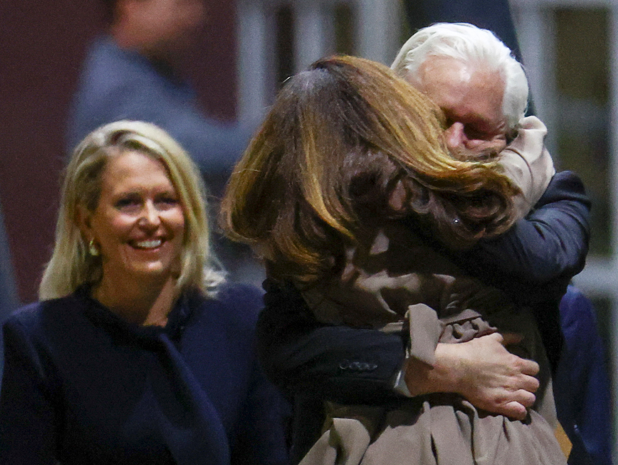 WikiLeaks founder Julian Assange embraces his wife Stella Assange as he arrives in Canberra, Australia, June 26, 2024. REUTERS