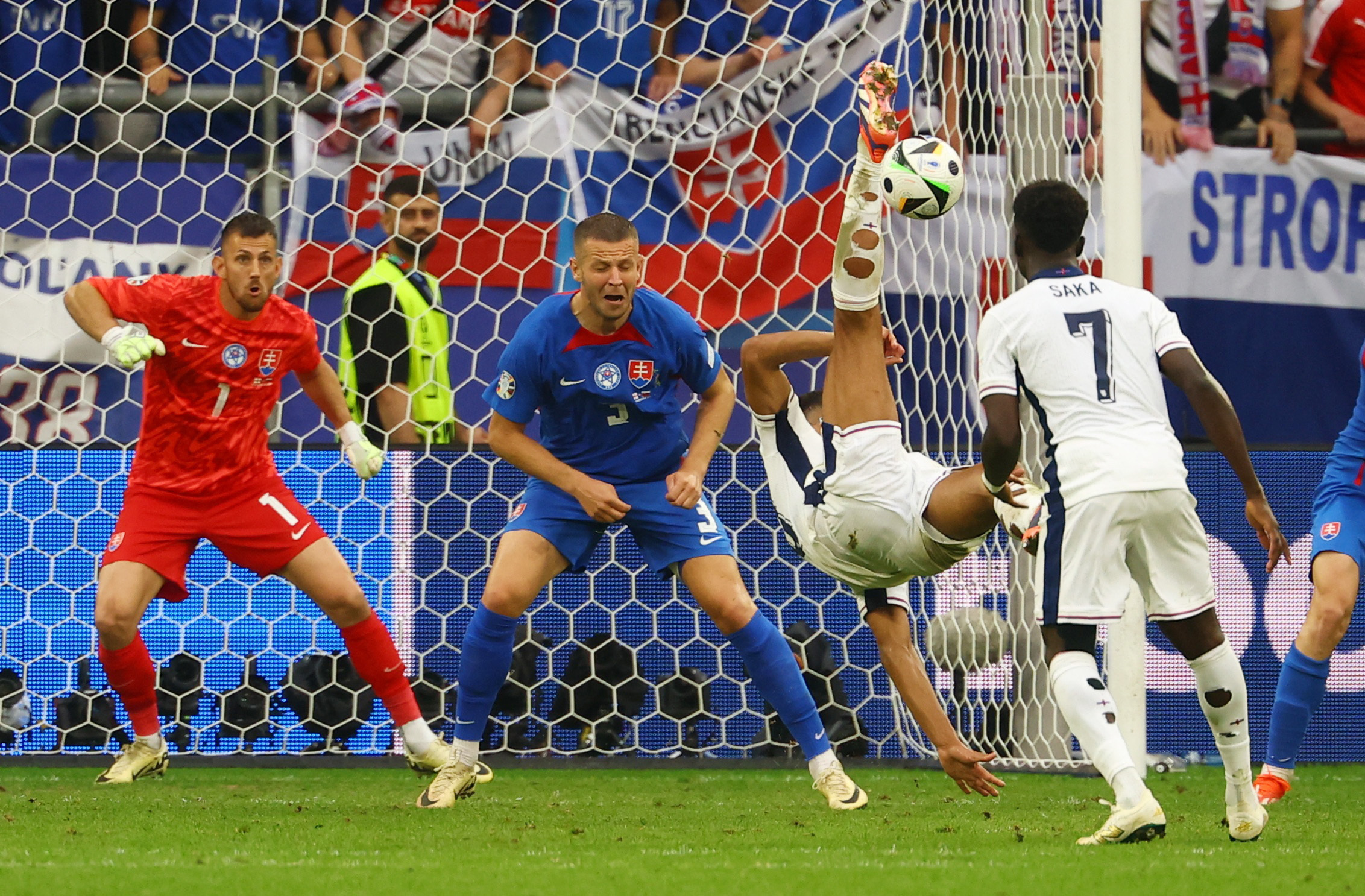 Soccer Football - Euro 2024 - Round of 16 - England v Slovakia - Arena AufSchalke, Gelsenkirchen, Germany - June 30, 2024 England's Jude Bellingham scores their first goal REUTERS
