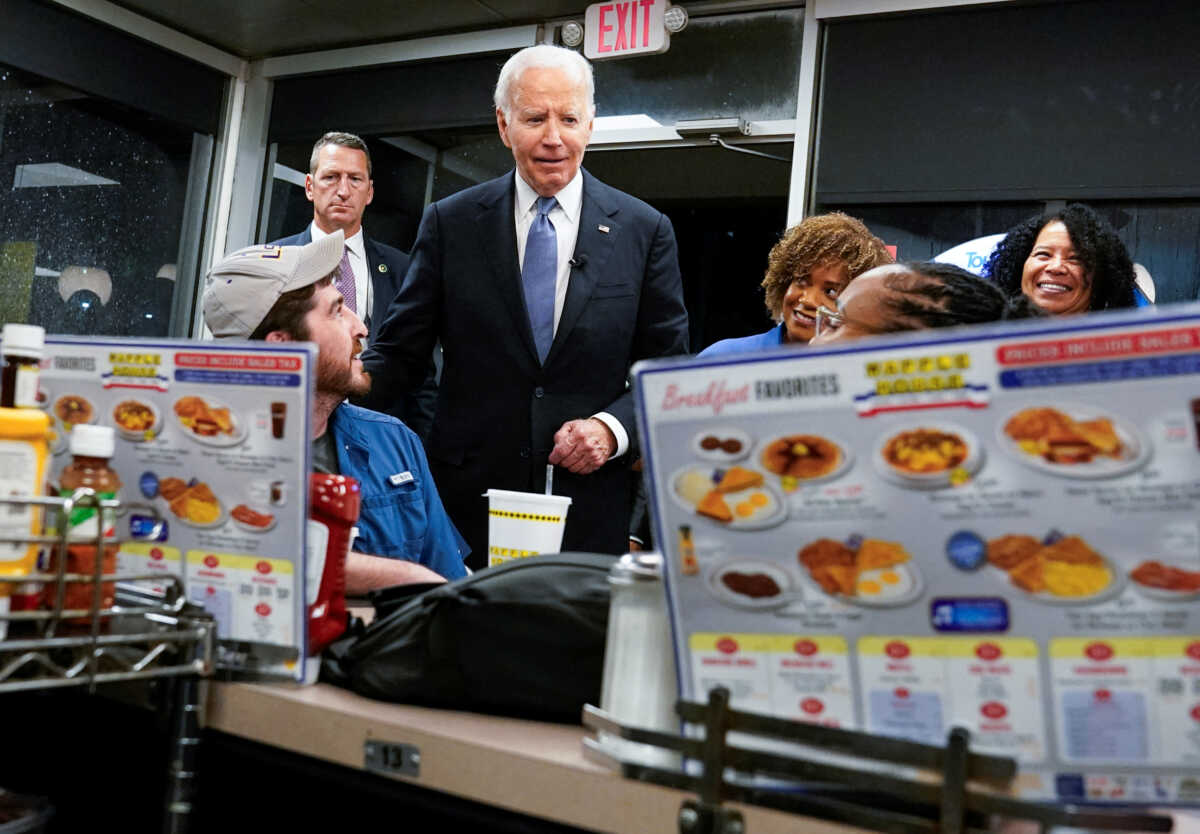 U.S. President Joe Biden meets people as he picks up an order from a Waffle House in Marietta, Georgia, after participating in a presidential debate in Atlanta, Georgia, U.S., June 28, 2024. REUTERS