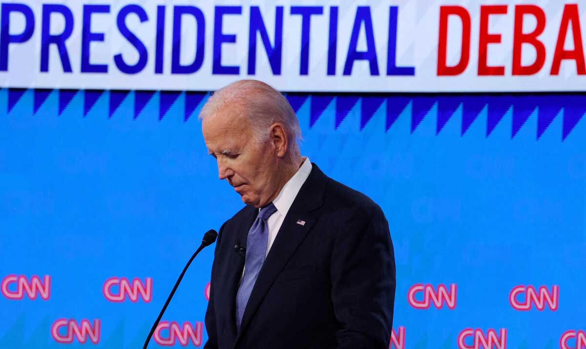 Democrat presidential candidate U.S. President Joe Biden listens as Republican presidential candidate and former U.S. President Donald Trump speaks during their debate in Atlanta, Georgia, U.S., June 27, 2024. REUTERS