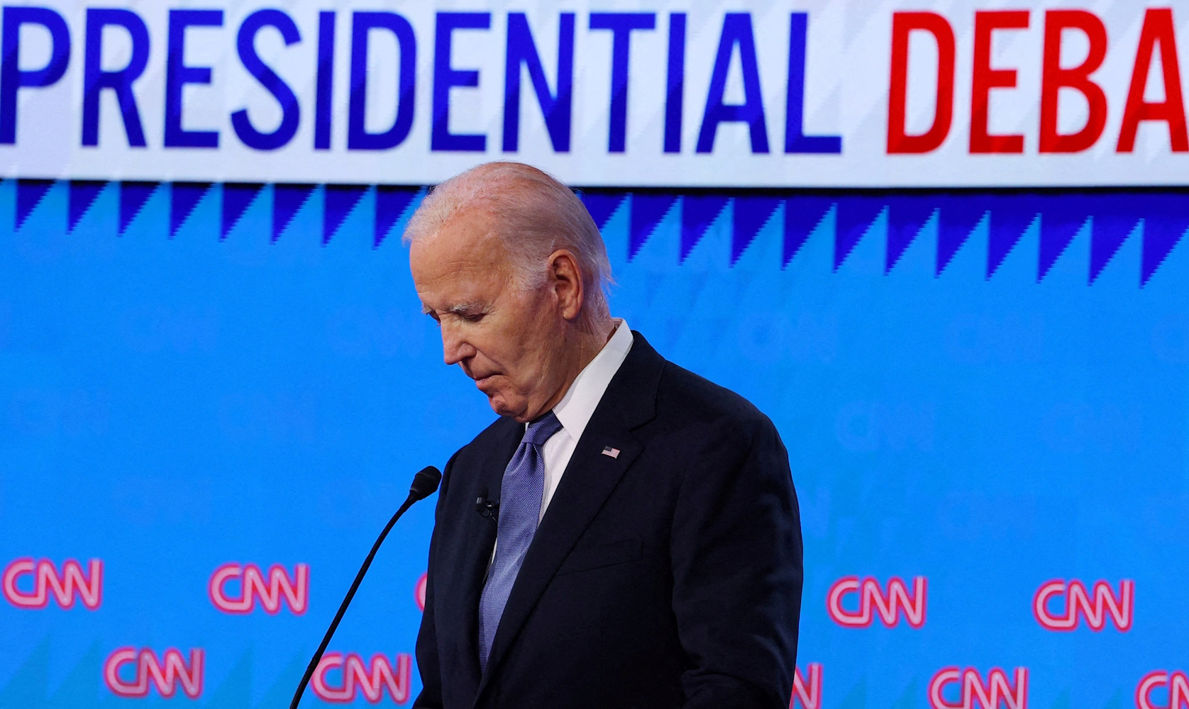Democrat presidential candidate U.S. President Joe Biden listens as Republican presidential candidate and former U.S. President Donald Trump speaks during their debate in Atlanta, Georgia, U.S., June 27, 2024. REUTERS