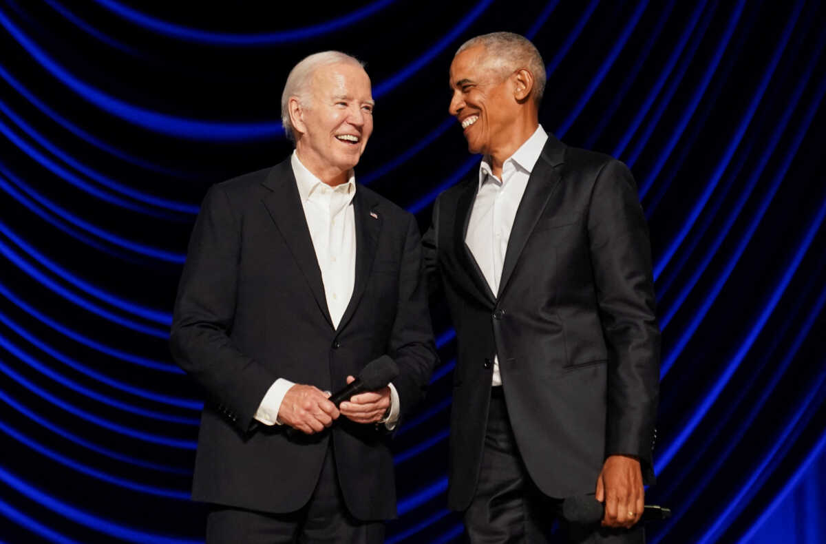 U.S. President Joe Biden and former U.S. President Barack Obama share a laugh during a star-studded campaign fundraiser at the Peacock Theater in Los Angeles, California, U.S., June 15, 2024. REUTERS