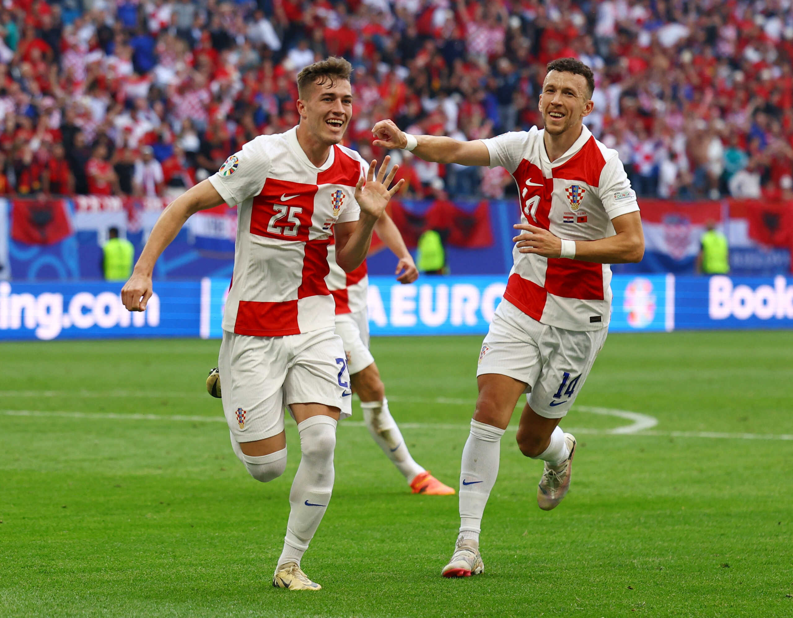 Soccer Football - Euro 2024 - Group B - Croatia v Albania - Hamburg Volksparkstadion, Hamburg, Germany - June 19, 2024 Croatia's Luka Sucic and Ivan Perisic celebrate their second goal, an own goal scored by Albania's Klaus Gjasula REUTERS