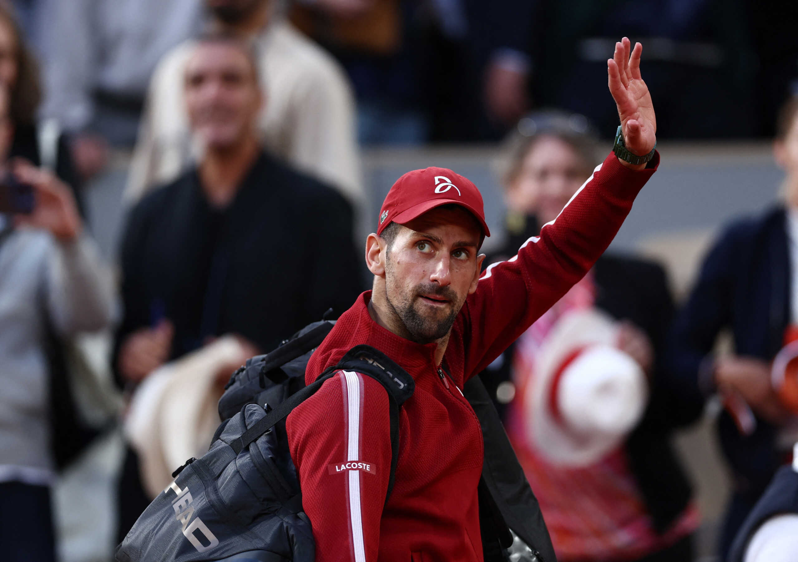Tennis - French Open - Roland Garros, Paris, France - June 3, 2024 Serbia's Novak Djokovic waves to fans as he leaves the court after winning his fourth round match against Argentina's Francisco Cerundolo REUTERS