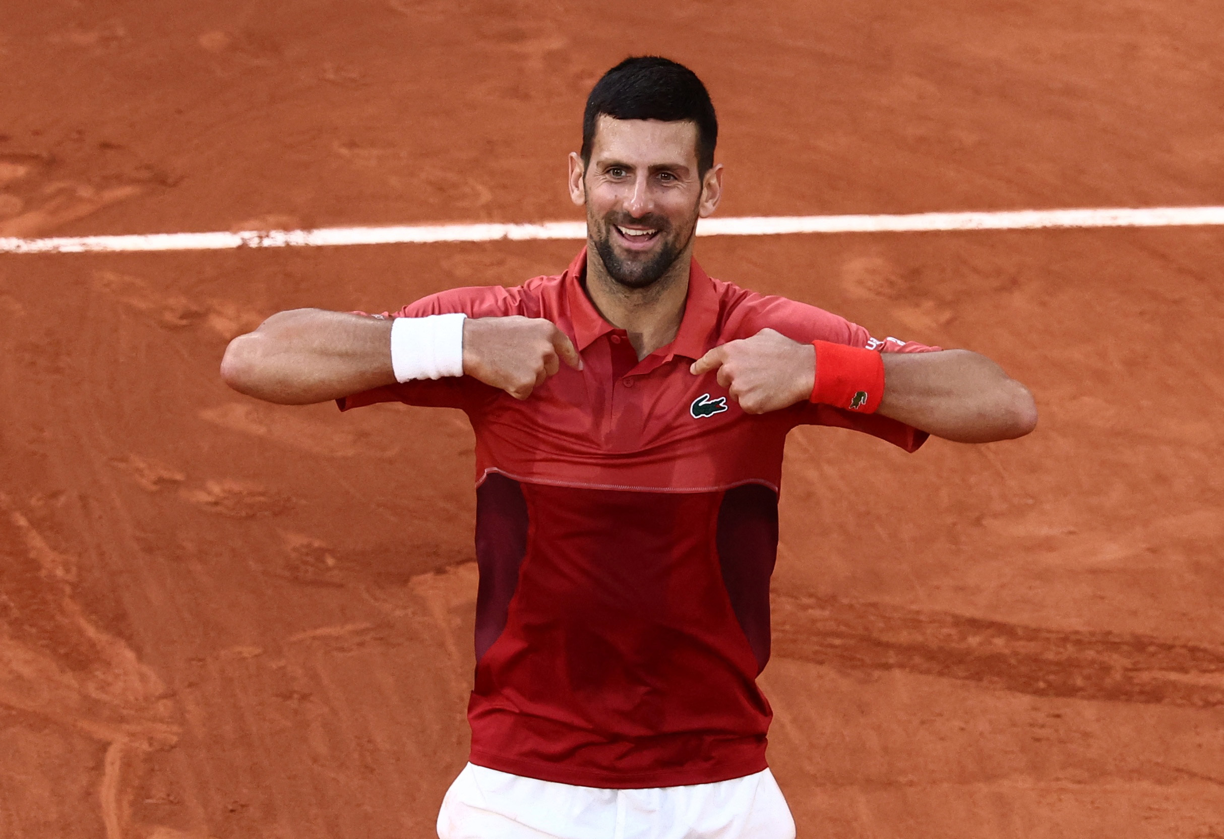 Tennis - French Open - Roland Garros, Paris, France - June 3, 2024 Serbia's Novak Djokovic celebrates after winning his fourth round match against Argentina's Francisco Cerundolo REUTERS
