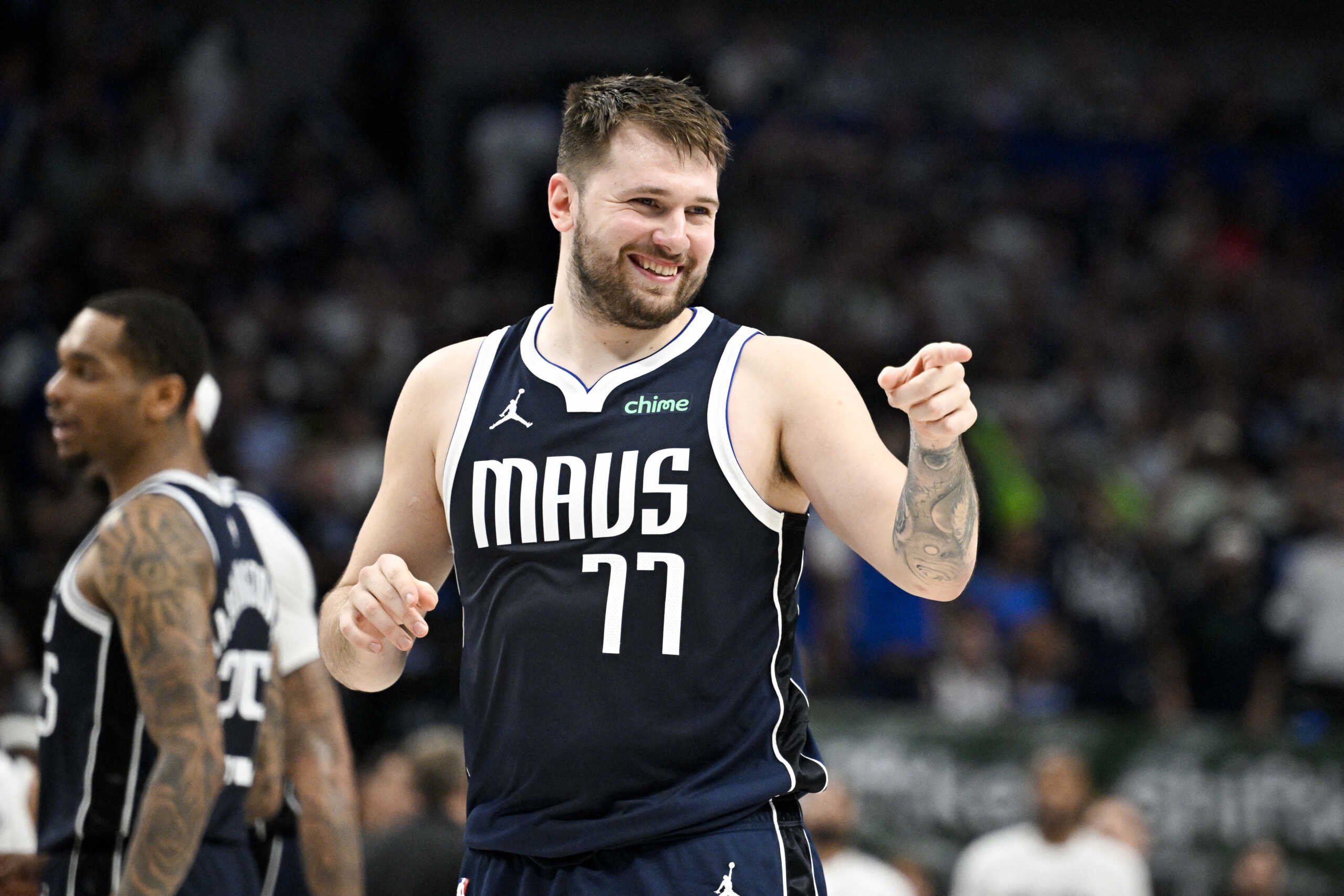 May 26, 2024; Dallas, Texas, USA; Dallas Mavericks guard Luka Doncic (77) points to the crowd during the second half against the Minnesota Timberwolves in game three of the western conference finals for the 2024 NBA playoffs at American Airlines Center. Mandatory Credit: Jerome Miron-USA TODAY Sports