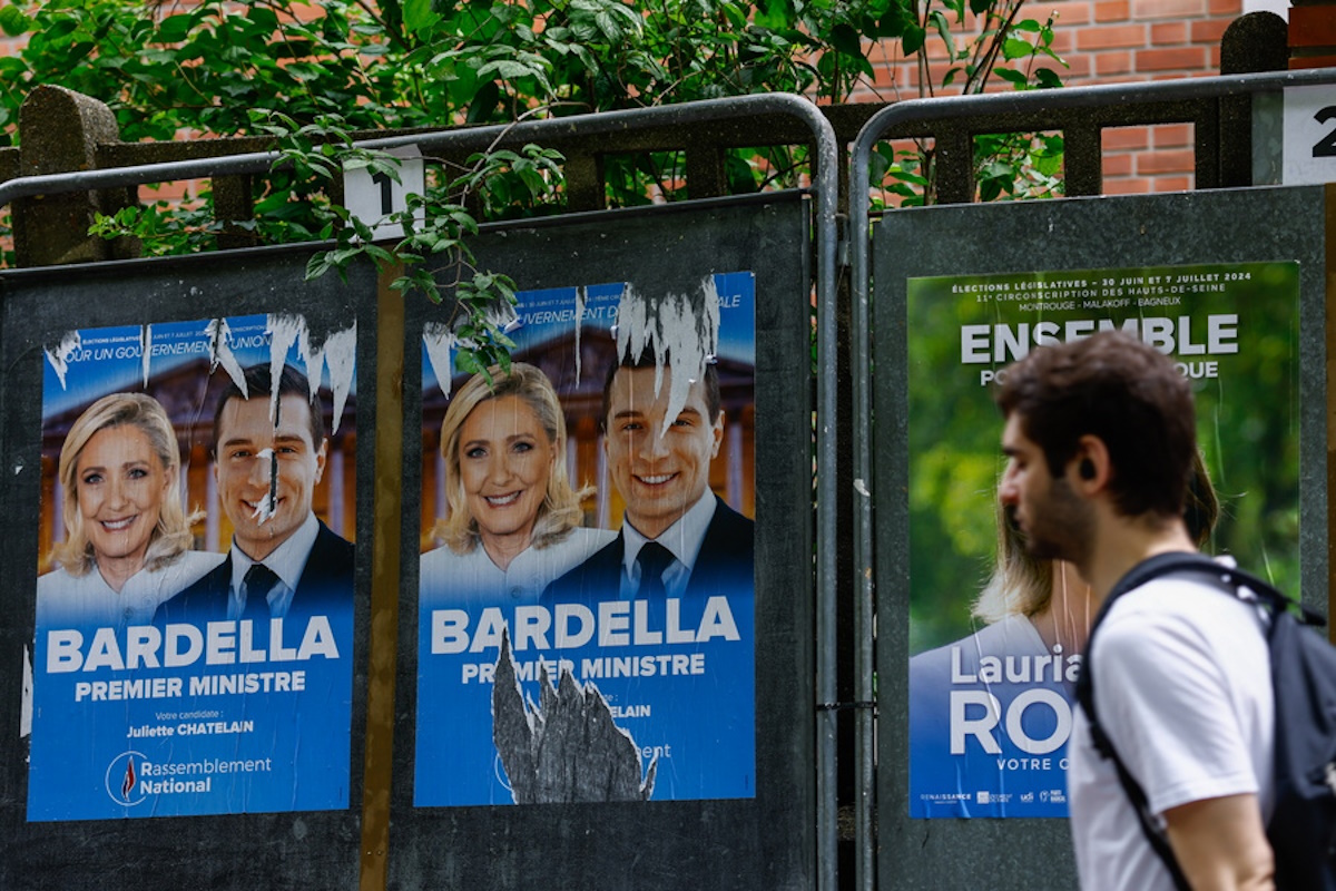 epa11444756 Legislative election posters on billboards, including French member of parliament and previous candidate for French presidential election Marine Le Pen (L) and Leader of the French extreme right party Rassemblement National (RN, National Front) Jordan Bardella (R), outside of polling station in Malakoff, near Paris, France, 29 June 2024. The upcoming snap legislative election in France takes place on 30 June and 07 July.  EPA