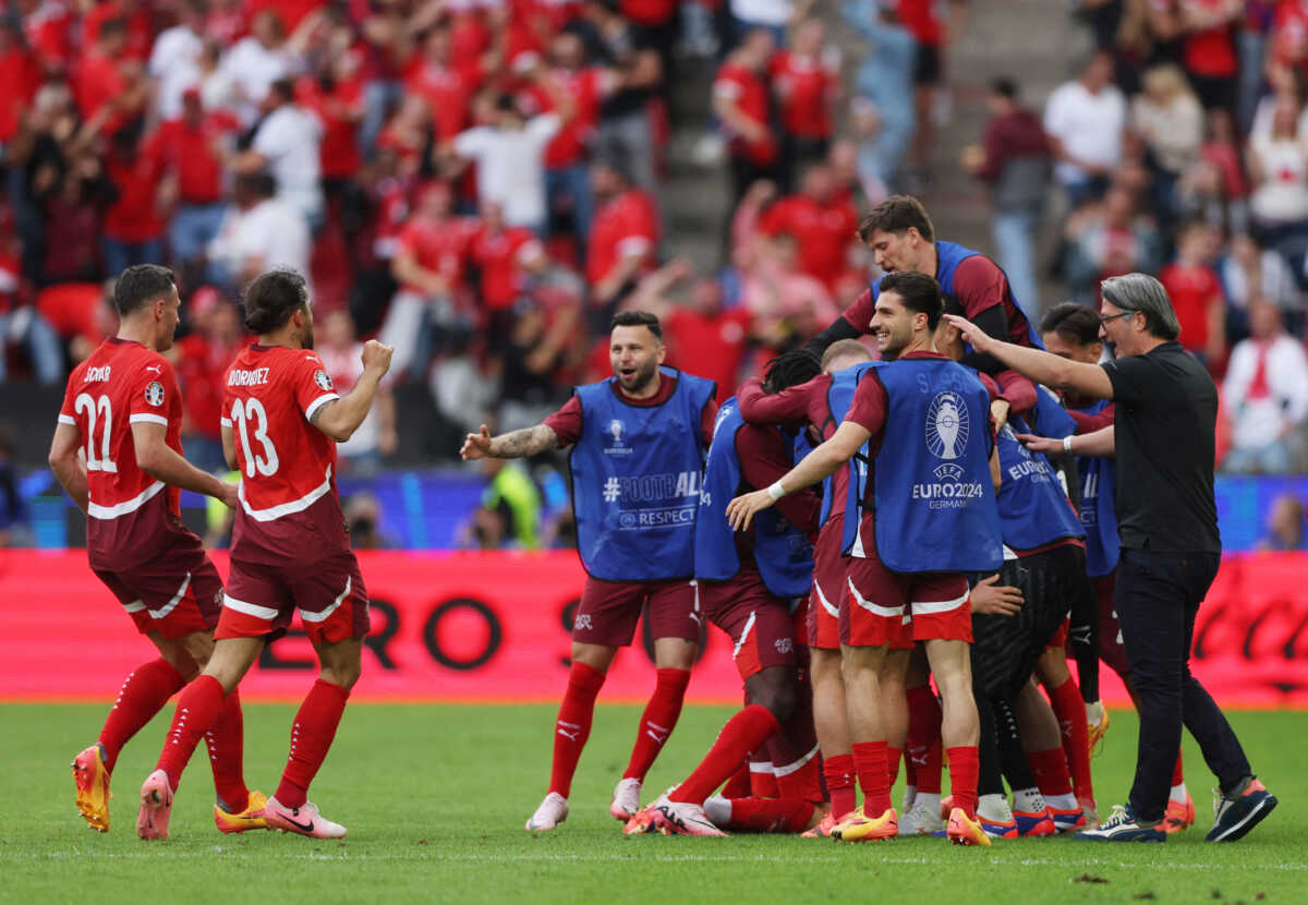 Soccer Football - Euro 2024 - Group A - Hungary v Switzerland - Cologne Stadium, Cologne, Germany - June 15, 2024 Switzerland's Michel Aebischer celebrates scoring their second goal with teammates and coach Murat Yakin REUTERS
