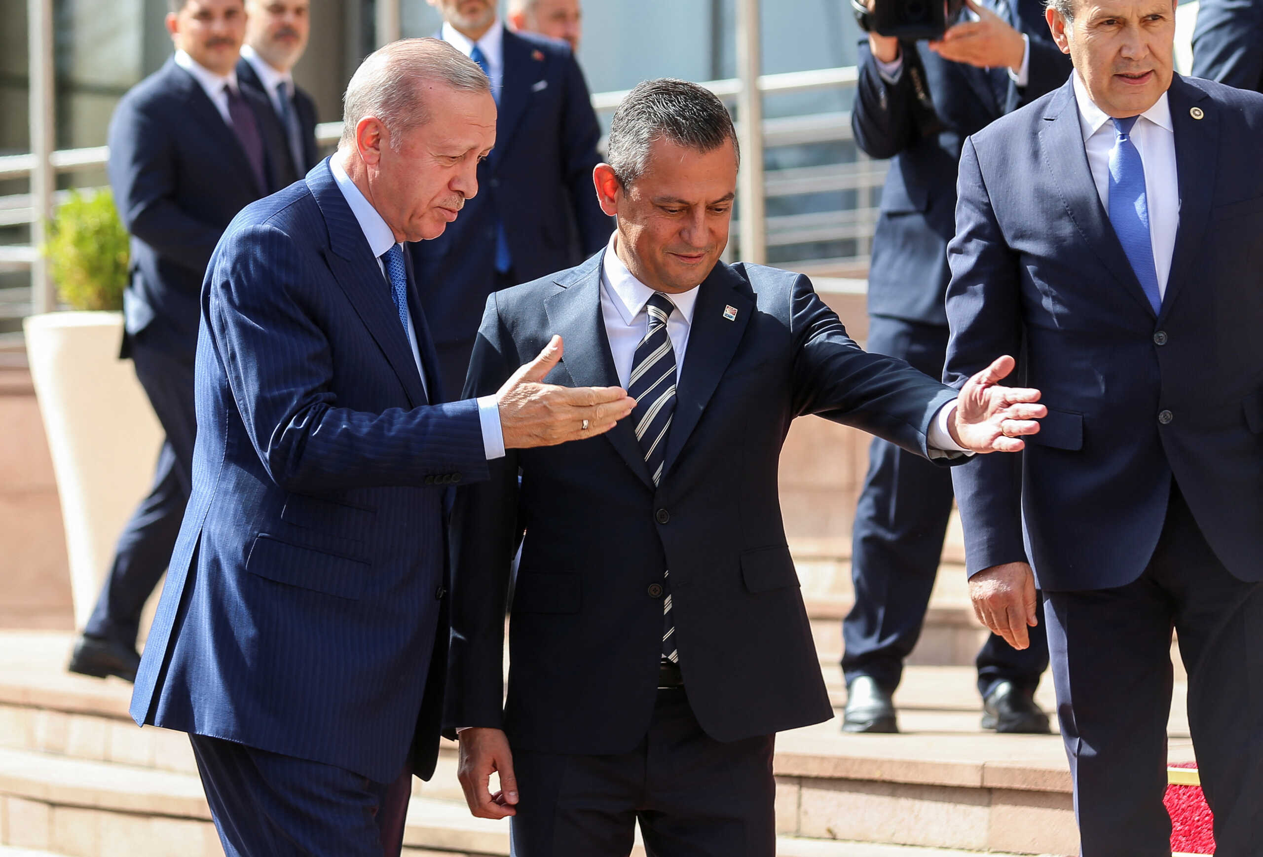 Turkish President and the leader of ruling Justice and Development Party (AK Party) Tayyip Erdogan is welcomed by Ozgur Ozel, leader of the main opposition Republican People’s Party (CHP) prior their meeting at the CHP headquarters in Ankara, Turkey, June 11, 2024. REUTERS
