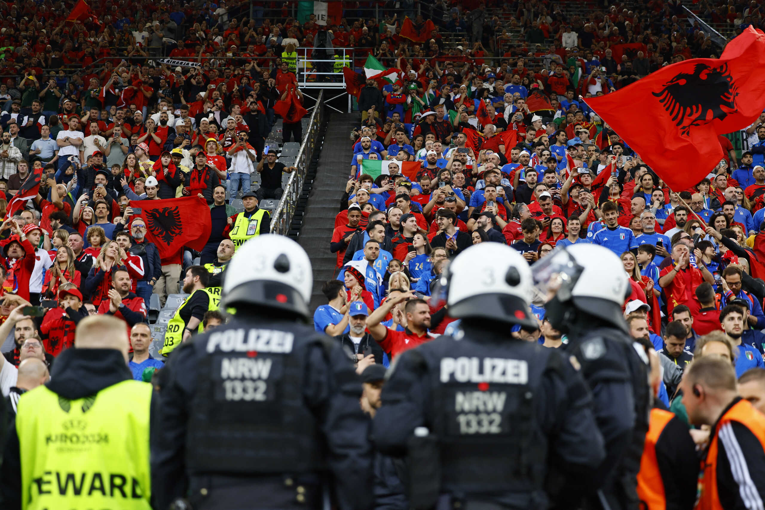 Soccer Football - Euro 2024 - Group B - Italy v Albania - Dortmund BVB Stadion, Dortmund, Germany - June 15, 2024 Albania and Italy fans in the stands before the match as Police look on REUTERS