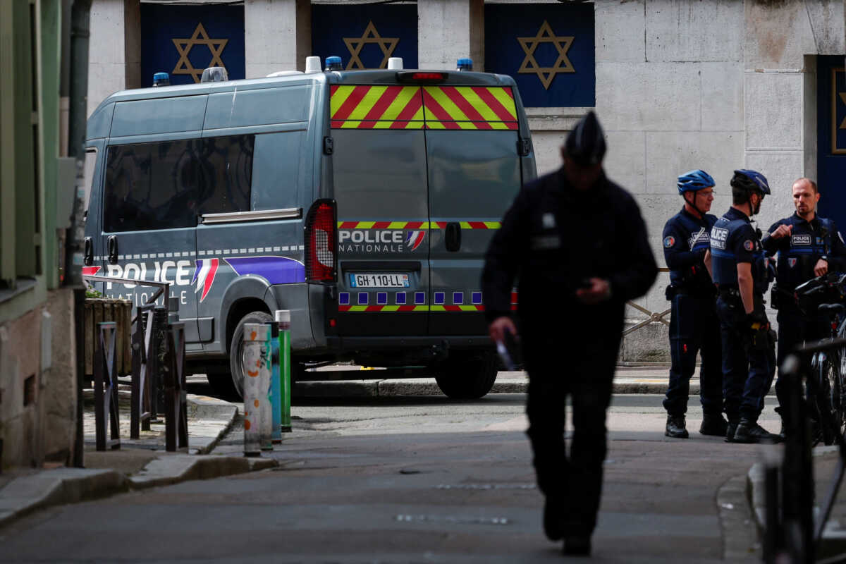 Police officers work after police shot dead an armed man earlier who set fire to the city's synagogue in Rouen, France, May 17, 2024. REUTERS