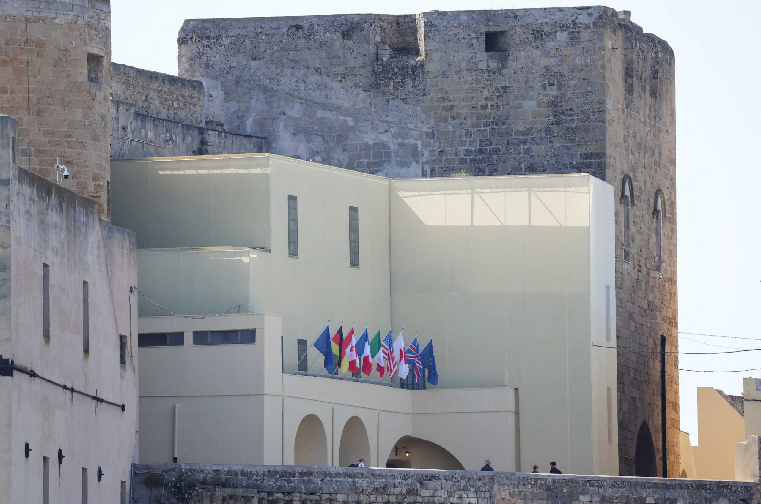 Flags of the G7 nations and the EU are seen at Castello Federiciano, the venue where the G7 summit's first dinner is scheduled to take place on June 13, in Brindisi, Italy, June 11, 2024. REUTERS