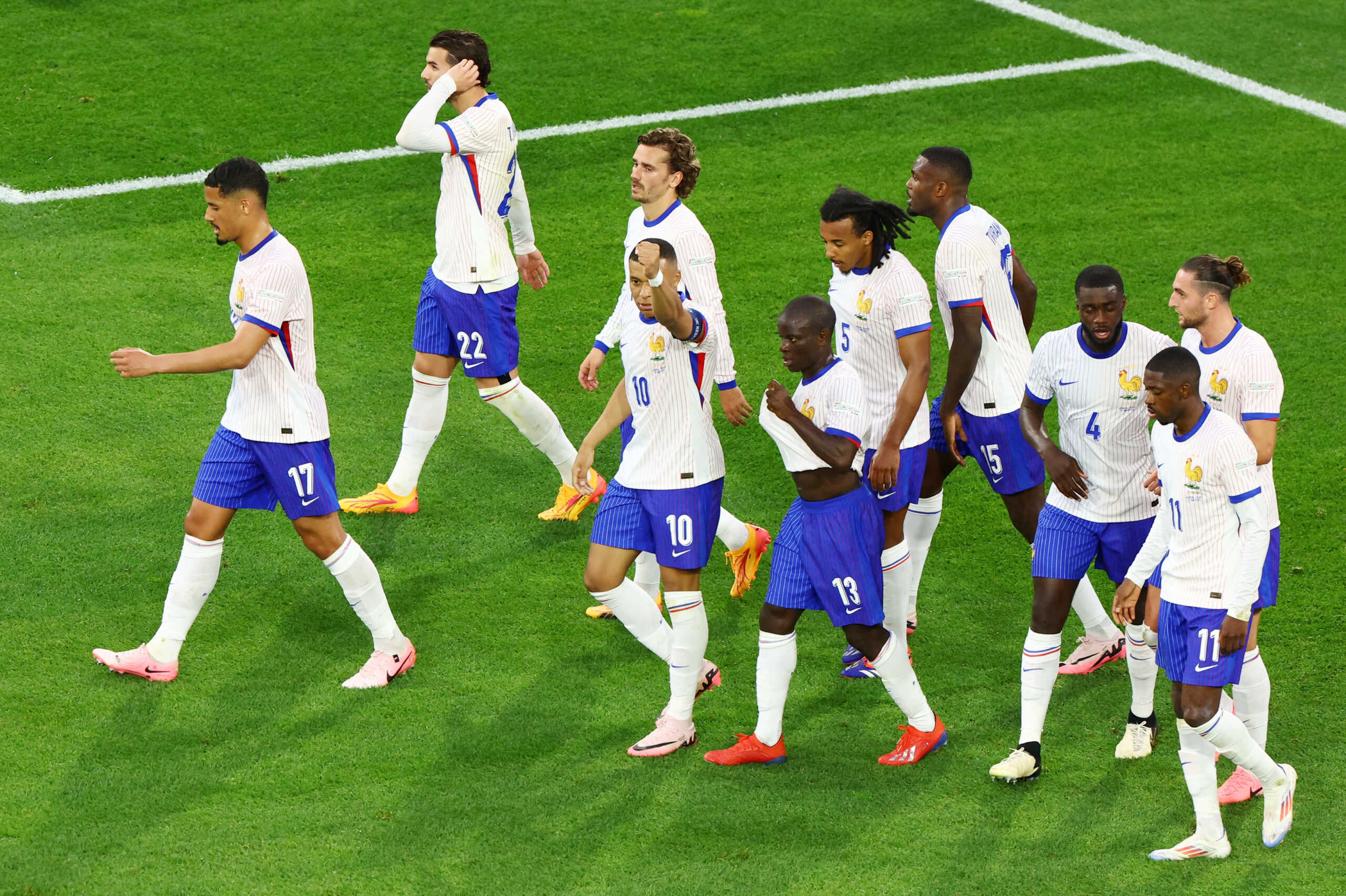 Soccer Football - Euro 2024 - Group D - Austria v France - Dusseldorf Arena, Dusseldorf, Germany - June 17, 2024 France's Kylian Mbappe and teammates celebrate after Austria's Maximilian Wober scores France first with an own goal REUTERS