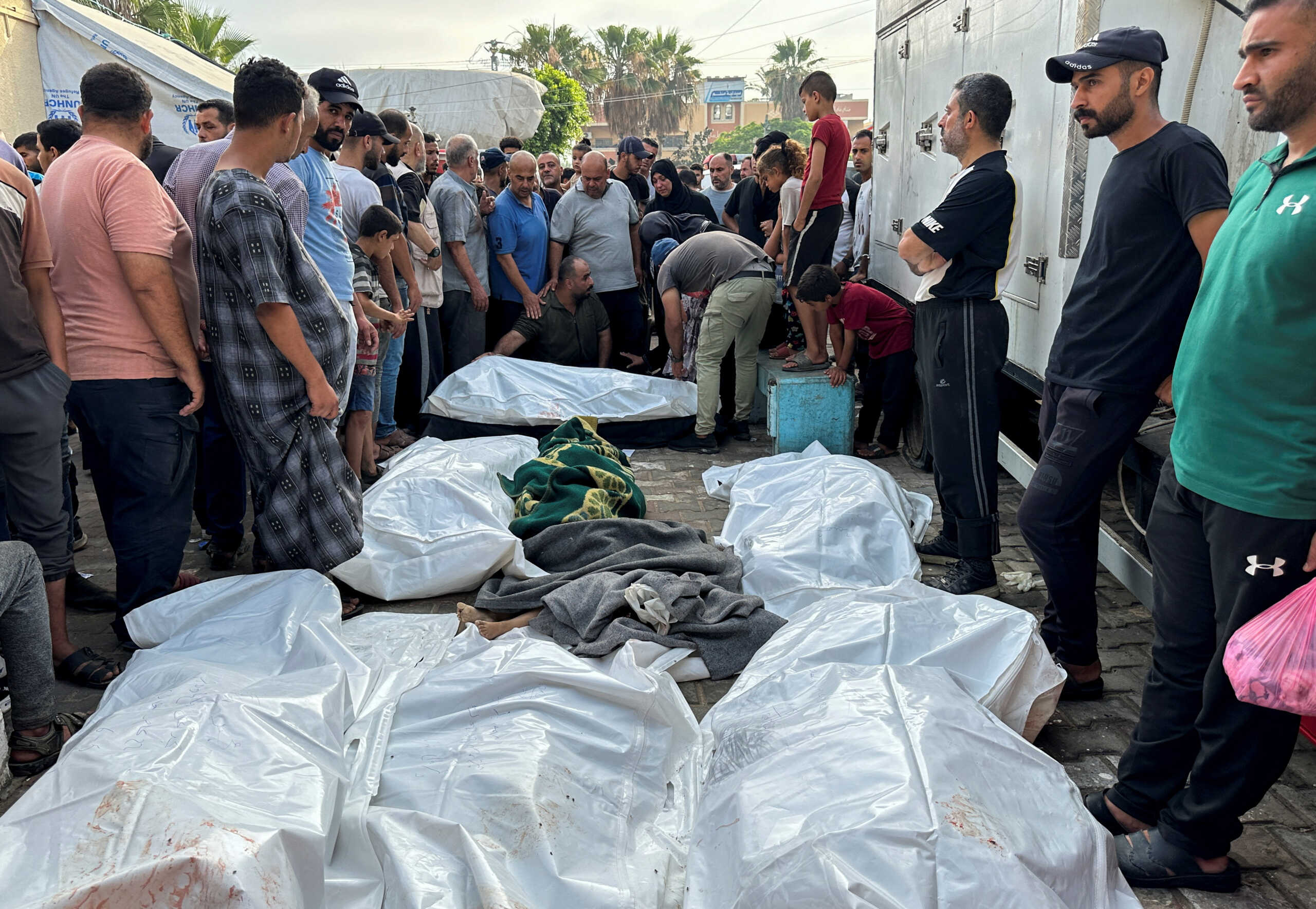 Mourners gather next to the bodies of Palestinians killed in Israeli strikes, amid the Israel-Hamas conflict, during their funeral at Al-Aqsa hospital in Deir Al-Balah, in central Gaza Strip June 5, 2024. REUTERS