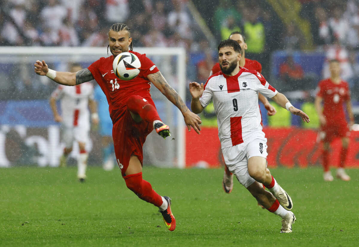 Soccer Football - Euro 2024 - Group F - Turkey v Georgia - Dortmund BVB Stadion, Dortmund, Germany - June 18, 2024 Turkey's Abdulkerim Bardakci in action with Georgia's Zuriko Davitashvili REUTERS