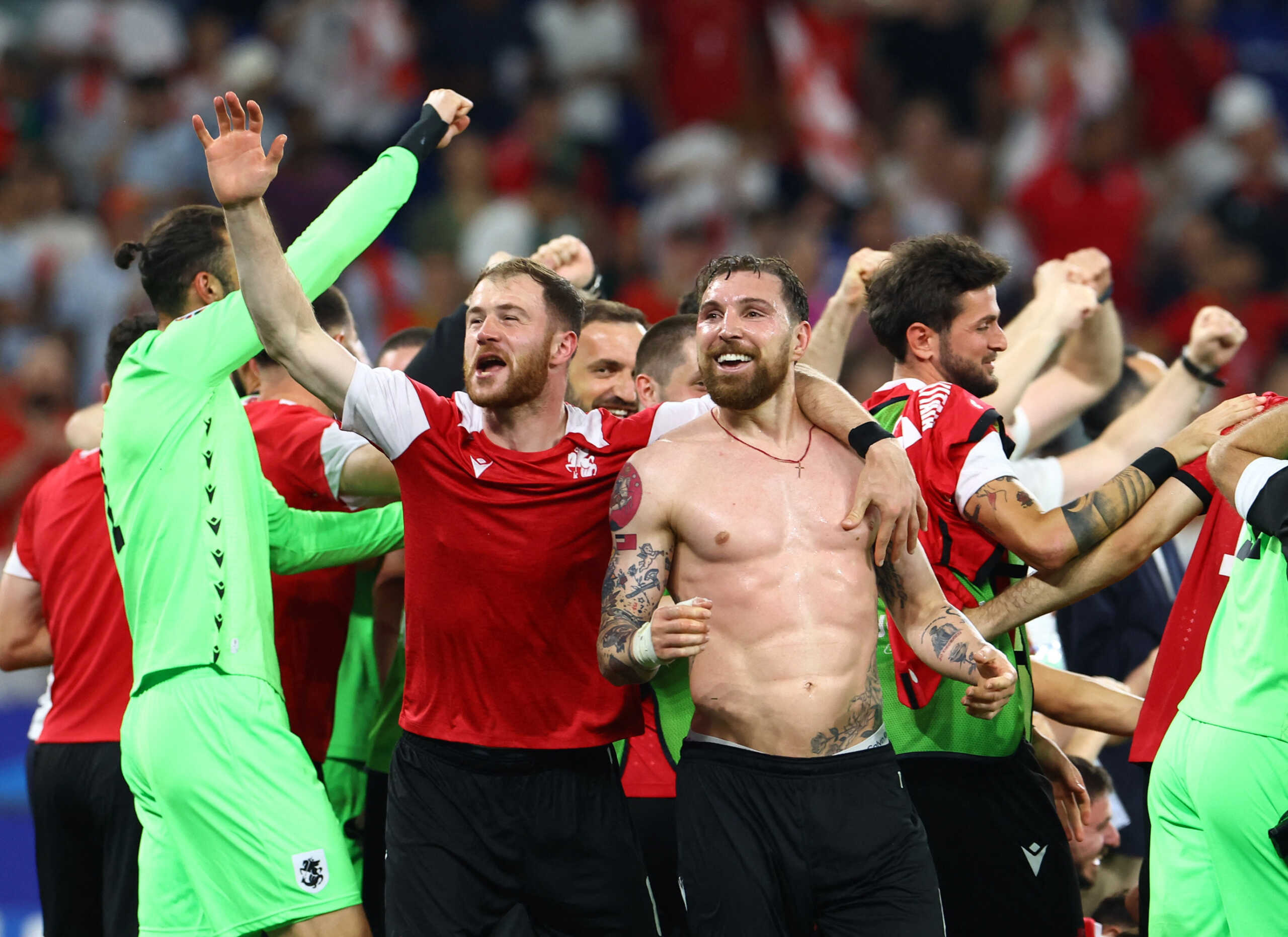 Soccer Football - Euro 2024 - Group F - Georgia v Portugal - Arena AufSchalke, Gelsenkirchen, Germany - June 26, 2024  Georgia's Guram Kashia with teammates celebrate after the match REUTERS
