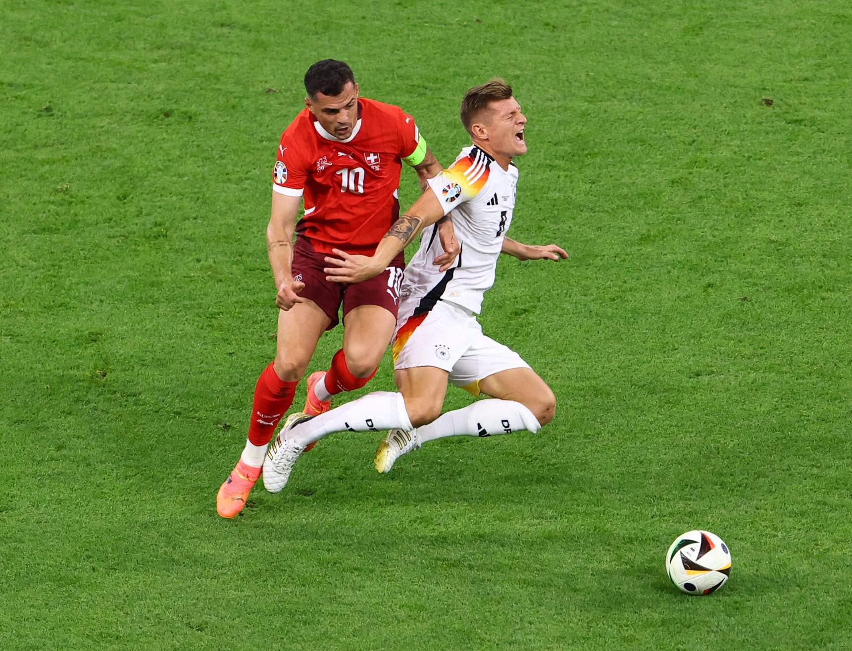 Soccer Football - Euro 2024 - Group A - Switzerland v Germany - Frankfurt Arena, Frankfurt, Germany - June 23, 2024 Germany's Toni Kroos in action with Switzerland's Granit Xhaka REUTERS