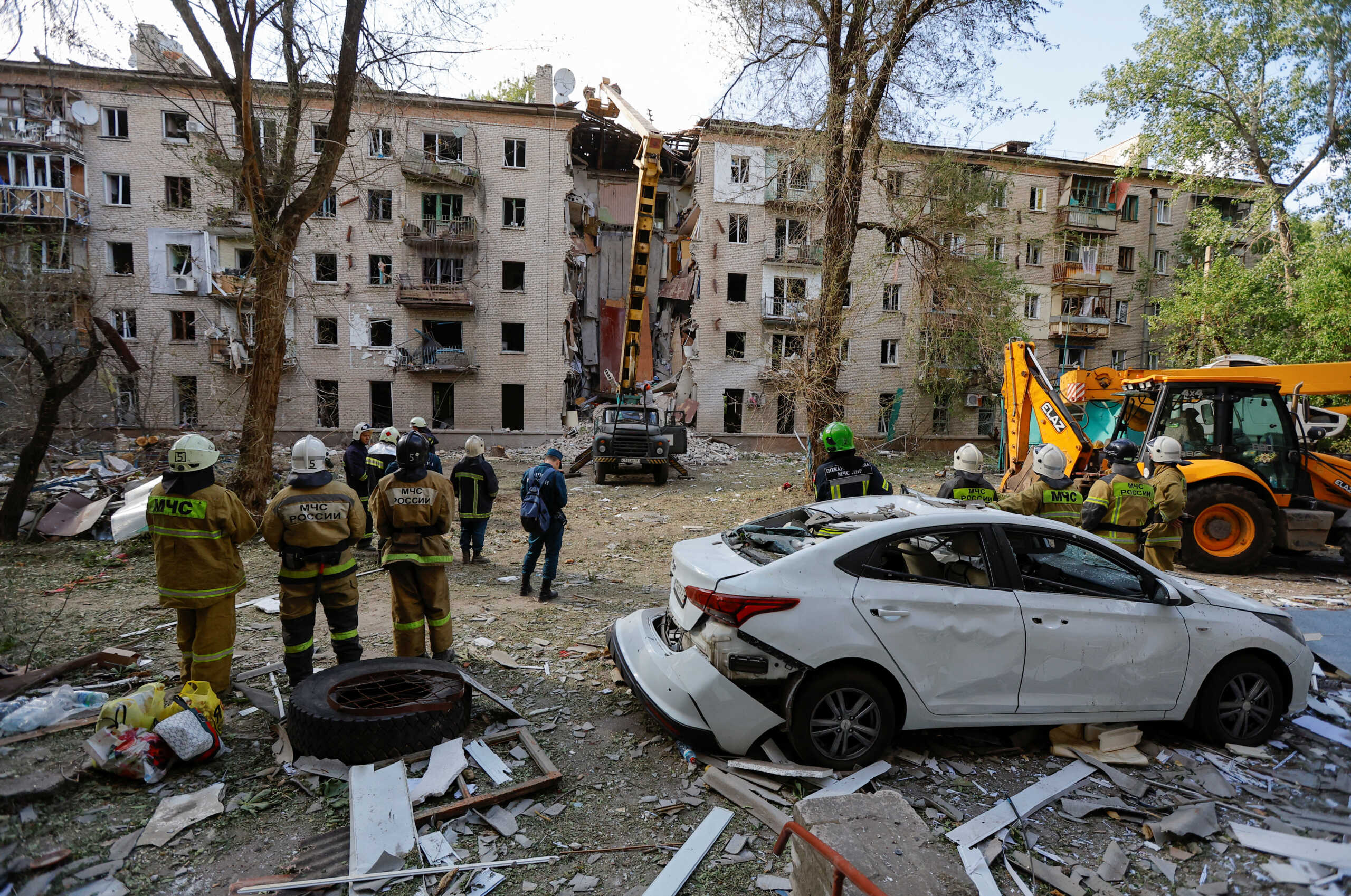 Emergency specialists work at a multi-storey residential building damaged in recent shelling by U.S.-supplied ATACMS missiles, according the Russian Defence Ministry, in the course of Russia-Ukraine conflict in Luhansk, Russian-controlled Ukraine, June 7, 2024. REUTERS