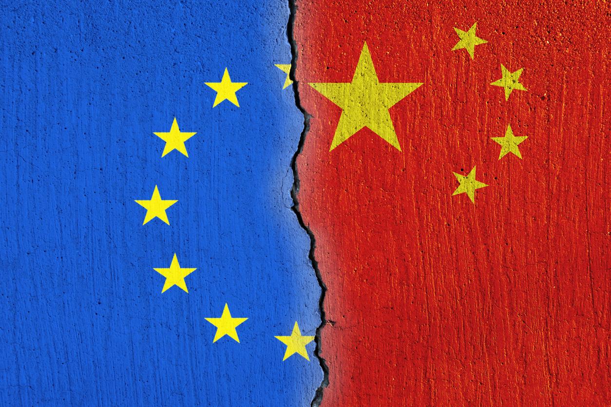 European Union flag  and Chinese flag painted on cracked wall , EU and China relations