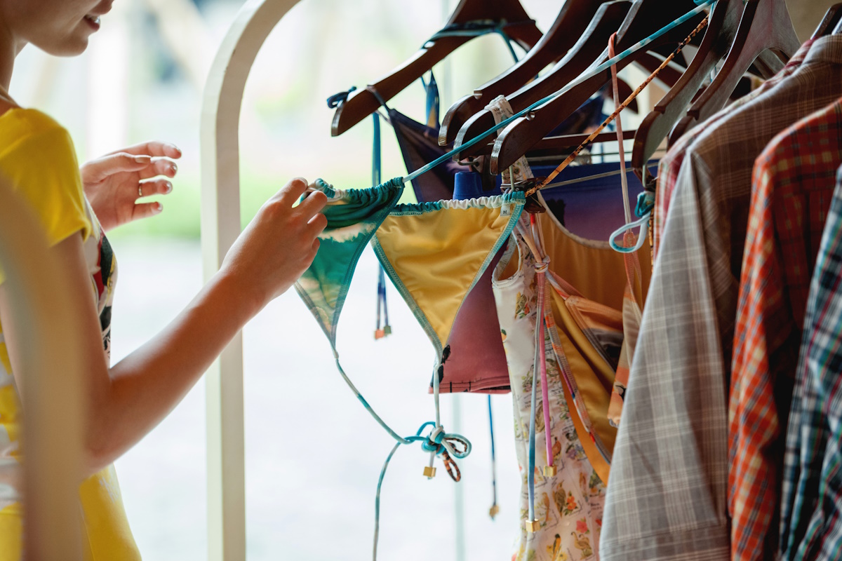 A young woman buys a bikini